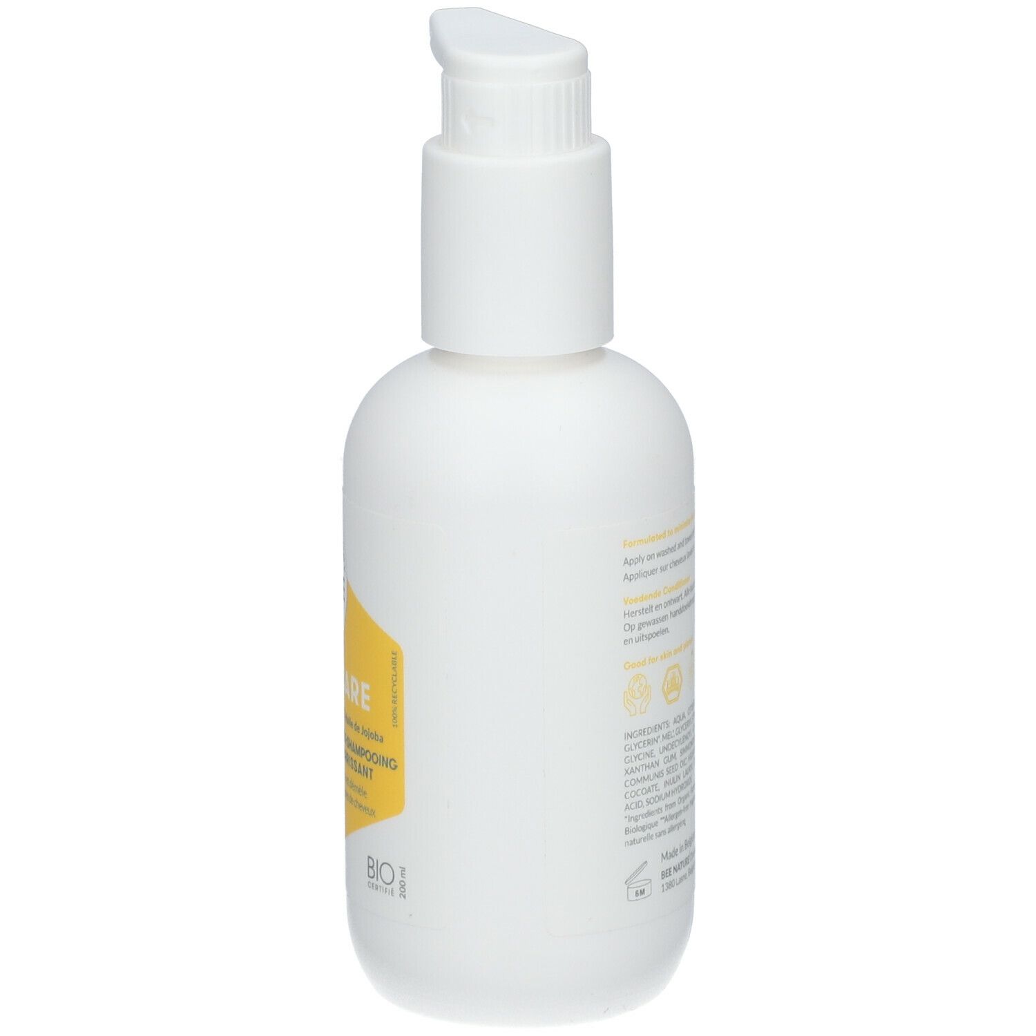 Flacon blanc avec pompe. Côté avec étiquette jaune et texte: Honey Care, Nourishing Conditioner, Après-shampooing nourrissant.