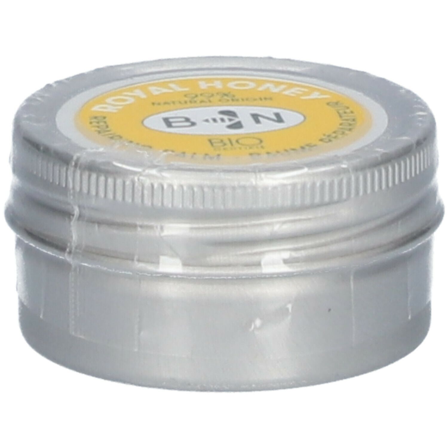Ronde zilverkleurige pot met gele deksel. Opschrift: ROYAL HONEY, B N, BIO. Verzegeld met folie.