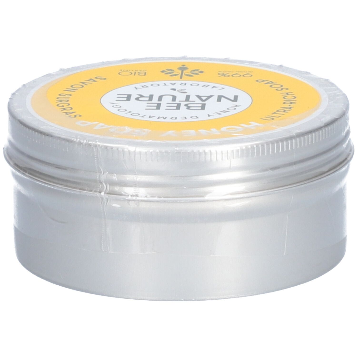 Ronde zilveren doos met gele deksel. Op de deksel staat "Honey Soap" en "Bee Nature".