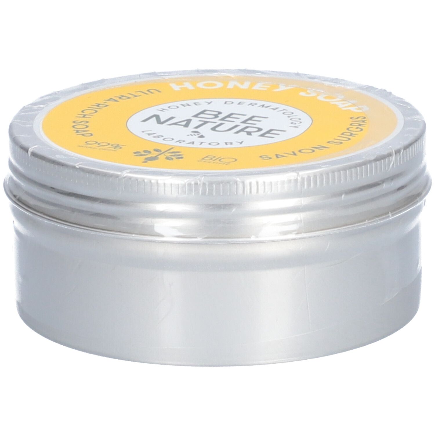 Ronde zilveren doos met gele deksel. Op de deksel staat "Honey Soap" en "Bee Nature".