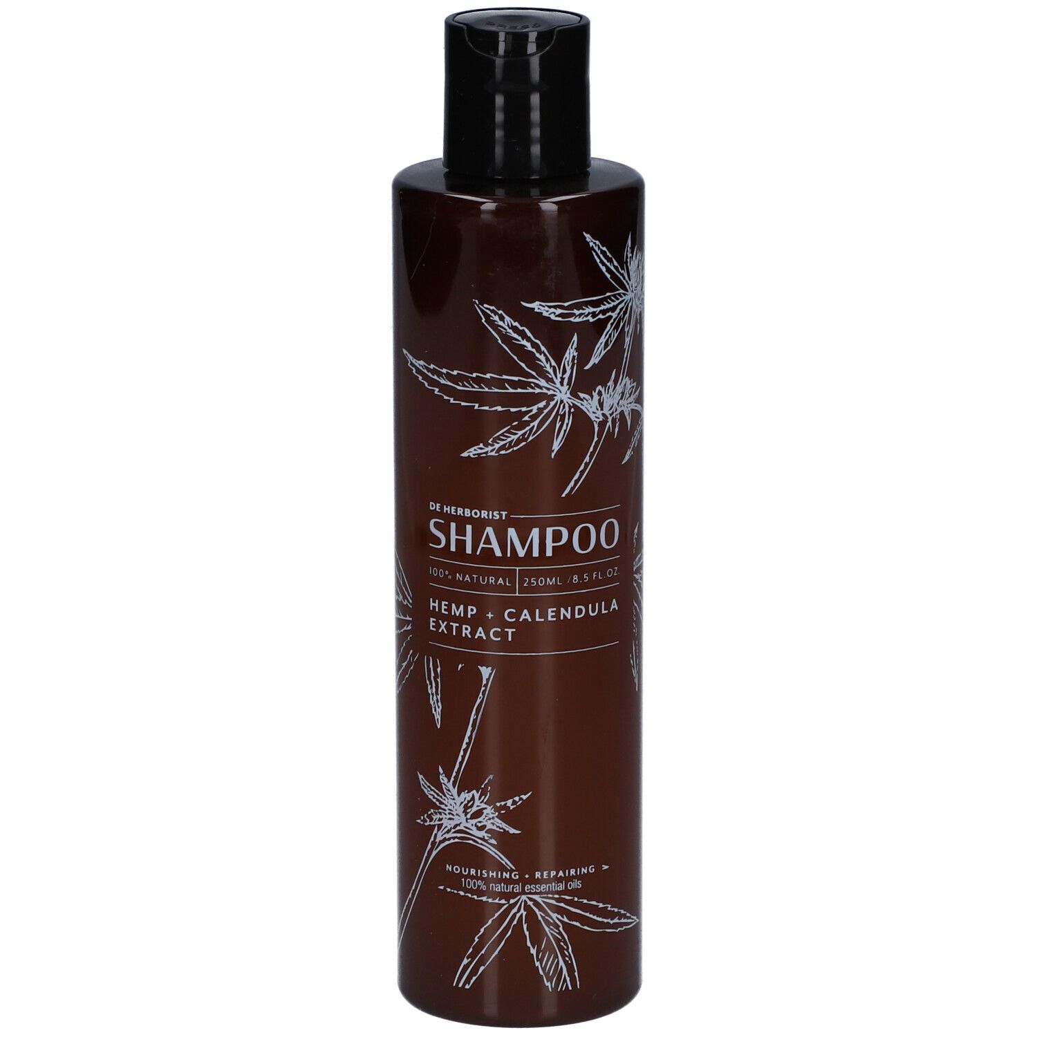 Bruine shampoo fles met zwarte dop. Witte tekst en henneptak decoratie. Tekst: Shampoo, Hennep + Calendula extract.