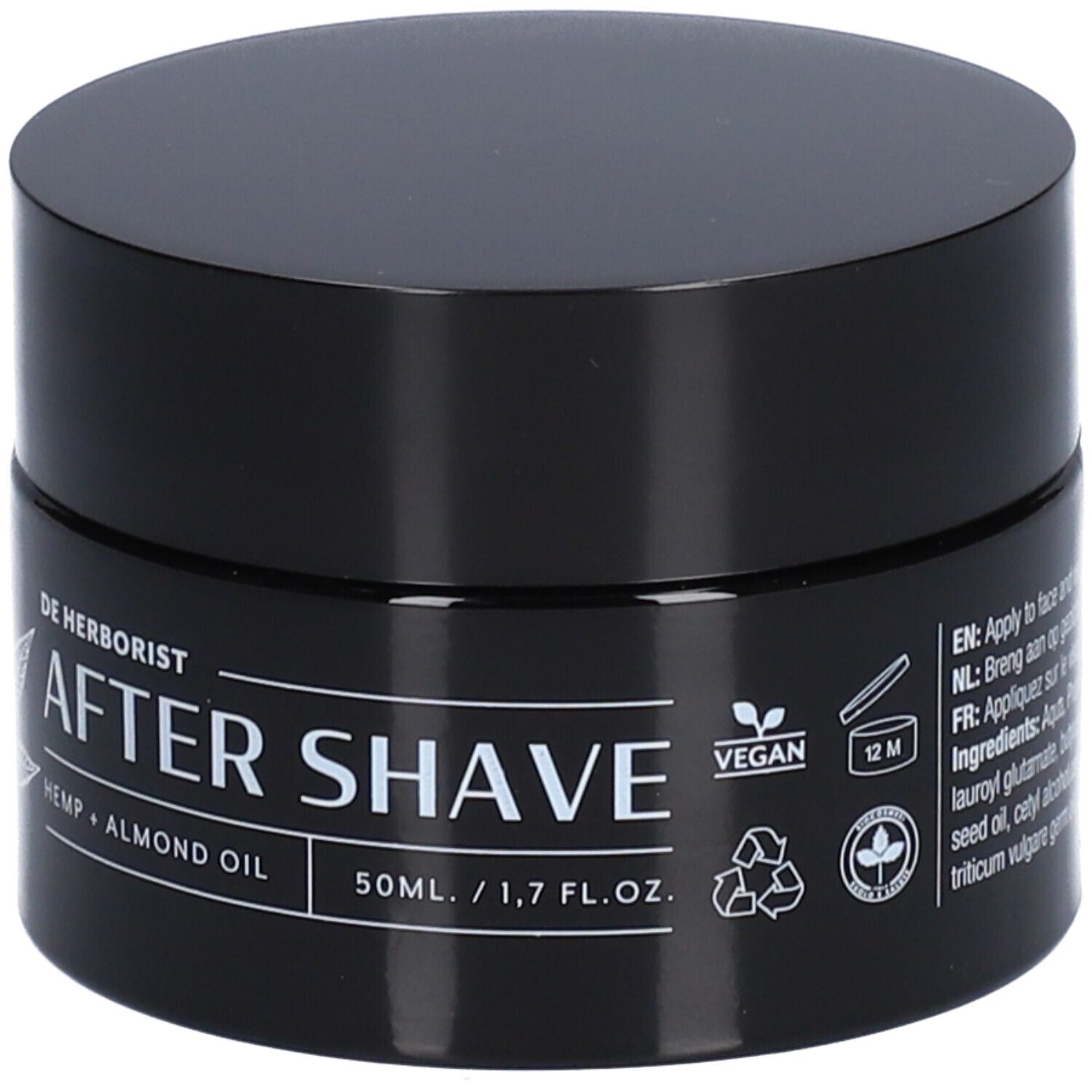 Zwarte pot met deksel. Opschrift: De Herborist, After Shave, Hennep + Amandelolie. Vegan-zegel. 12M-symbool.