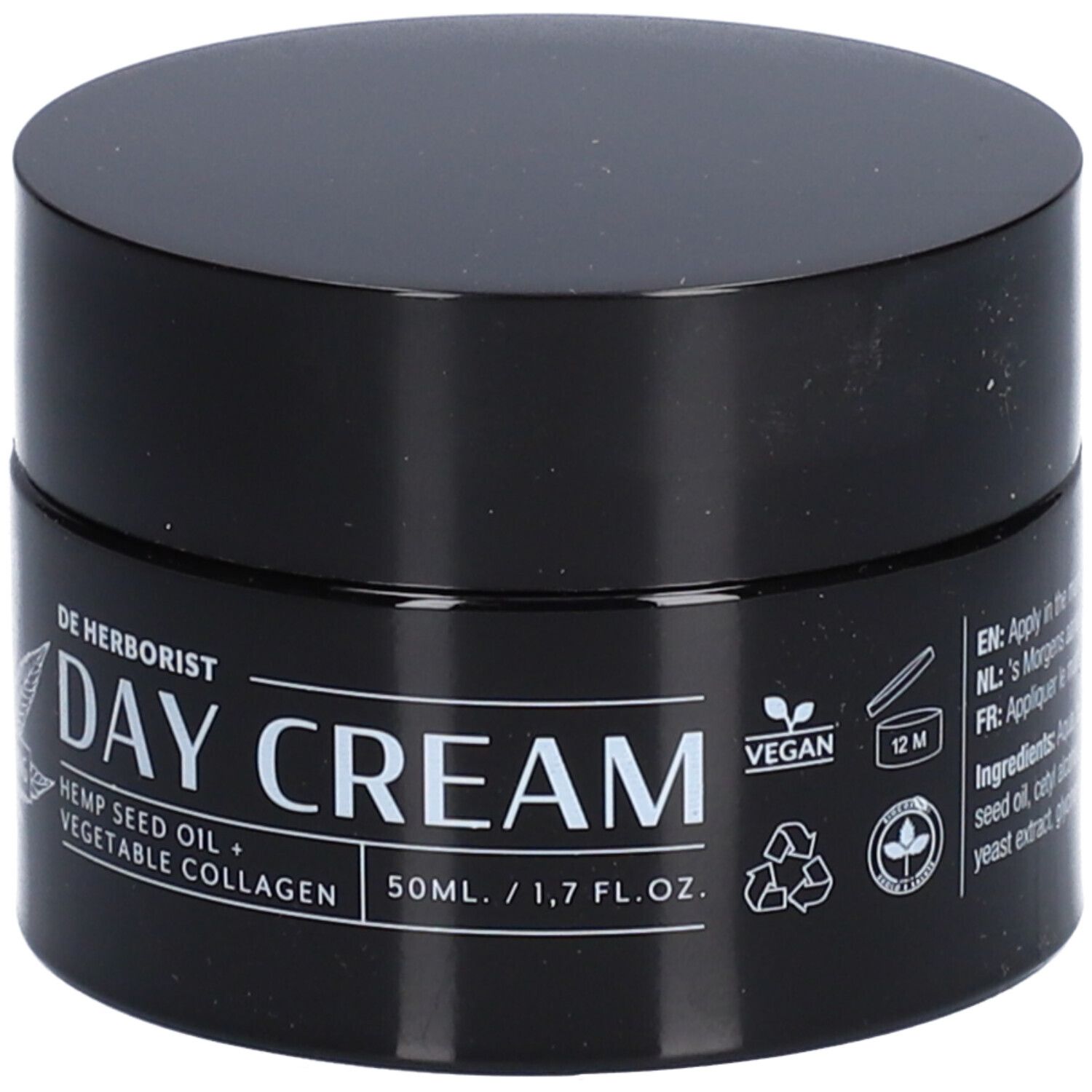 Pot noir avec couvercle. Inscription : DAY CREAM, huile de graines de chanvre + collagène végétal. Label végan. Symbole 12M.