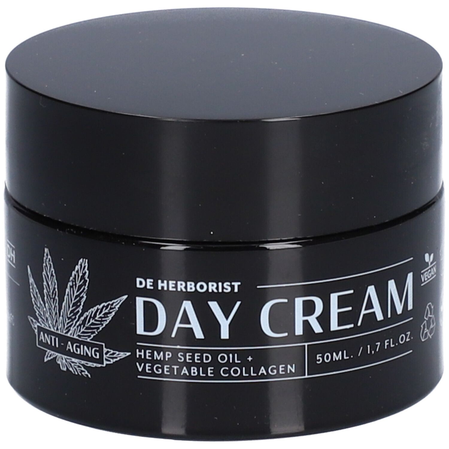 Pot noir avec couvercle. Inscription : DE HERBORIST, DAY CREAM, huile de graines de chanvre + collagène végétal. Formule anti-âge.