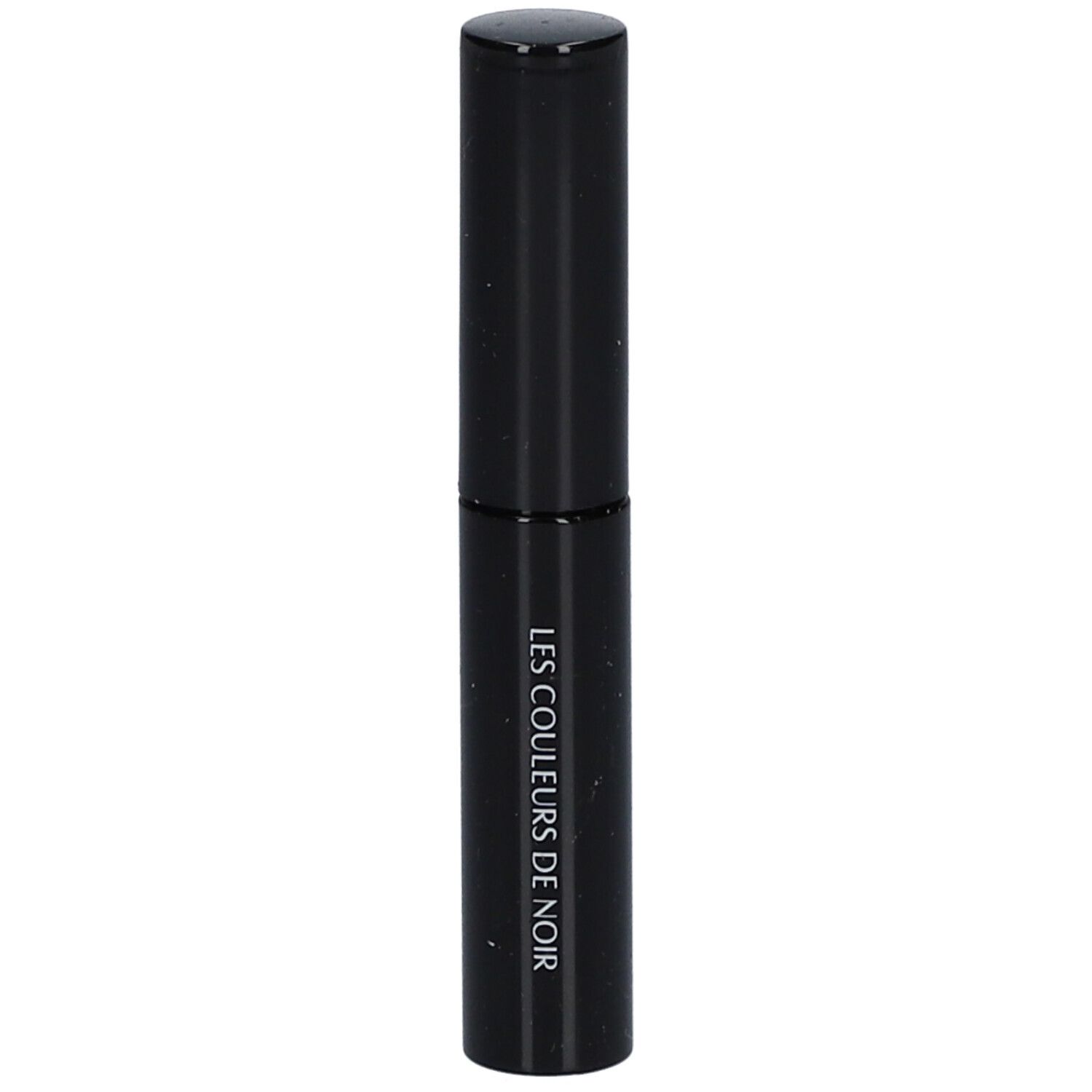 Tube noir avec bouchon. Inscription: LES COULEURS DE NOIR.