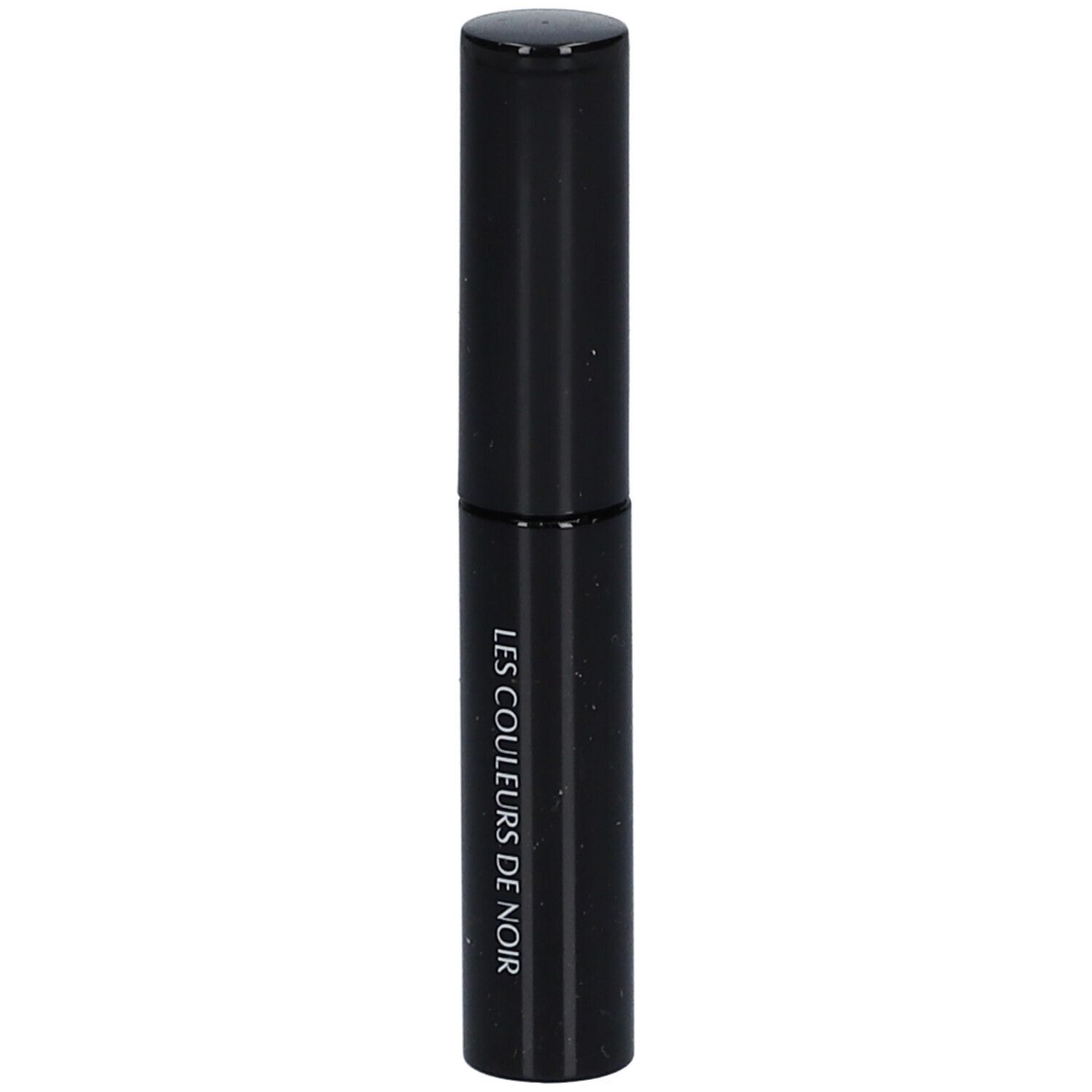 Tube noir avec bouchon. Inscription: LES COULEURS DE NOIR.
