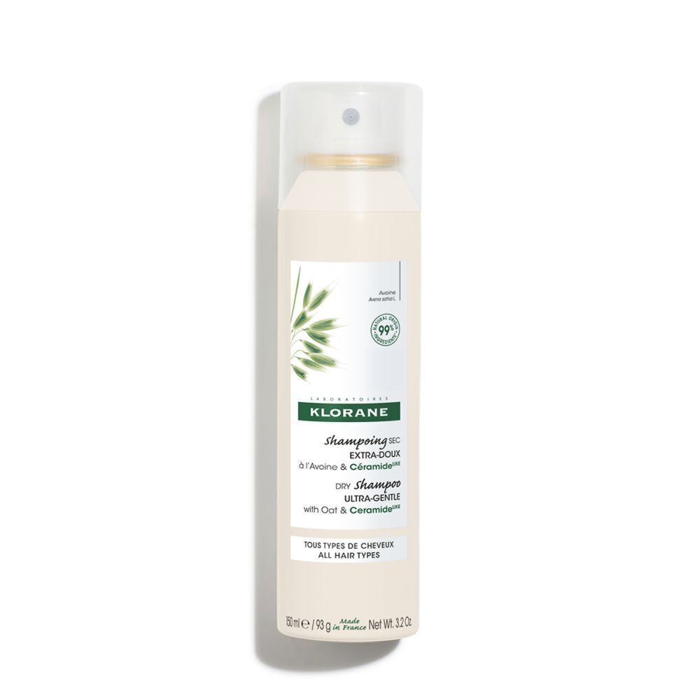 Droogshampoo sprayfles. Wit, met groen etiket. Bevat haver en ceramiden. Met verstuiver.
