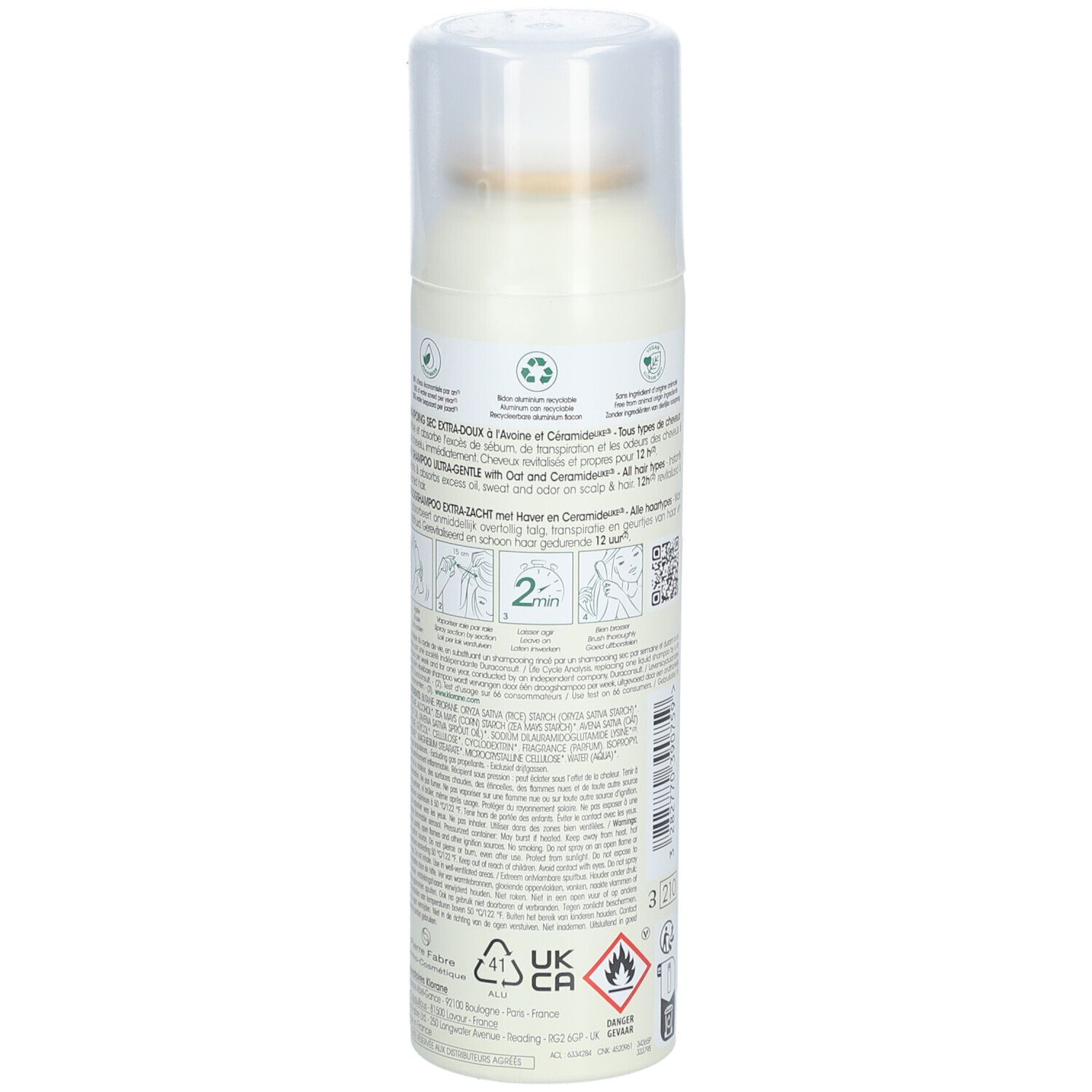 Achterkant van de droogshampoo sprayfles. Tekst en symbolen. Bevat haver en ceramiden.