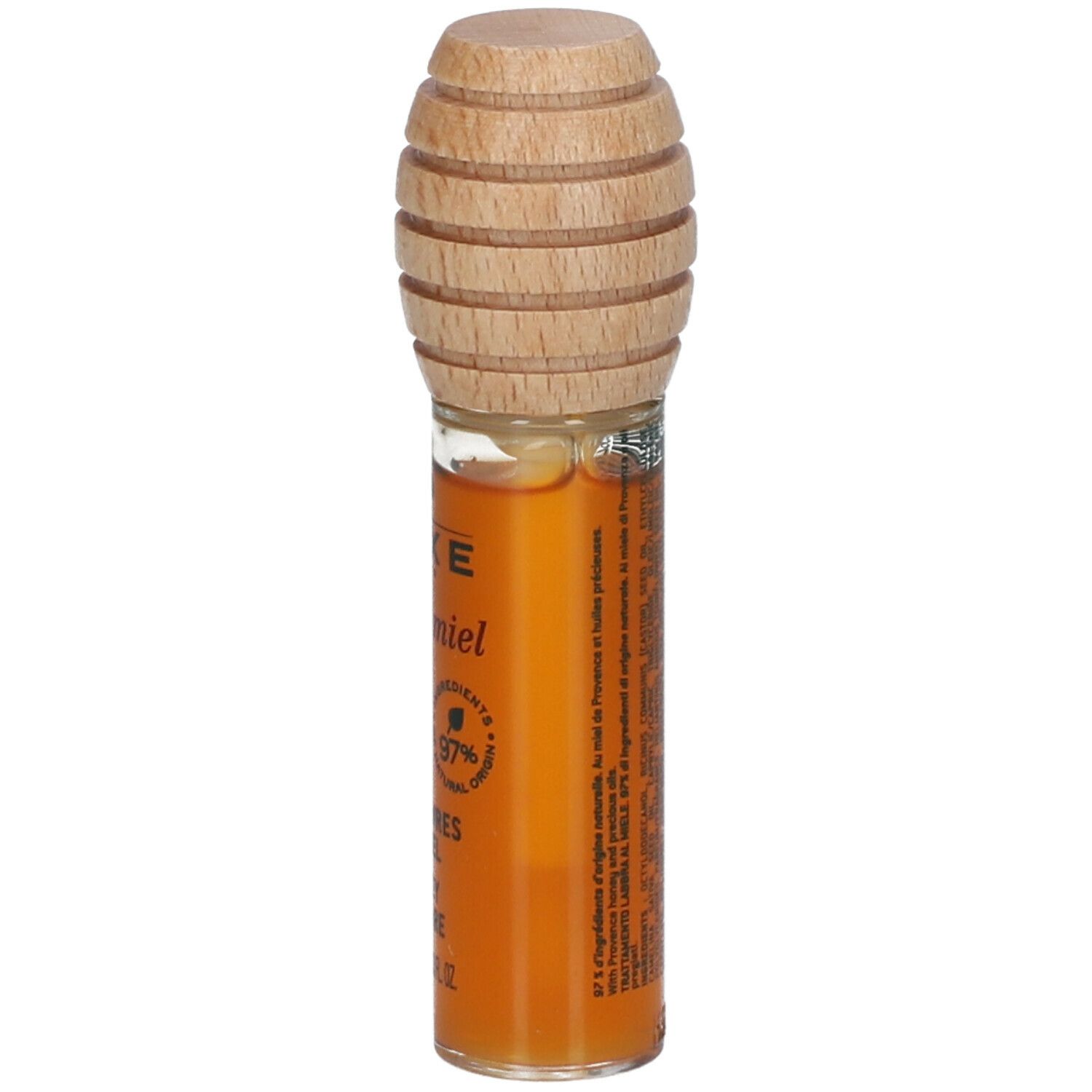 Soin lèvres au miel. Tube en verre avec bouchon en bois. Inscription: NUXE, Rêve de Miel, 97% ingrédients naturels.