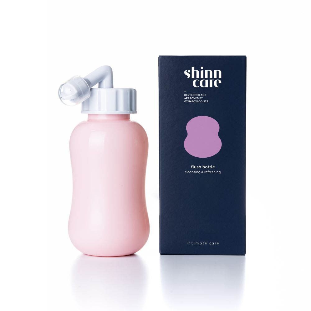 Roze spoelfles met witte opzet en verpakking. Opschrift: Intimate Care.