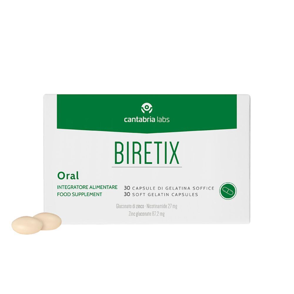 Witte doos met groene band. Opschrift Biretix Oral, 30 capsules. Twee capsules ernaast.