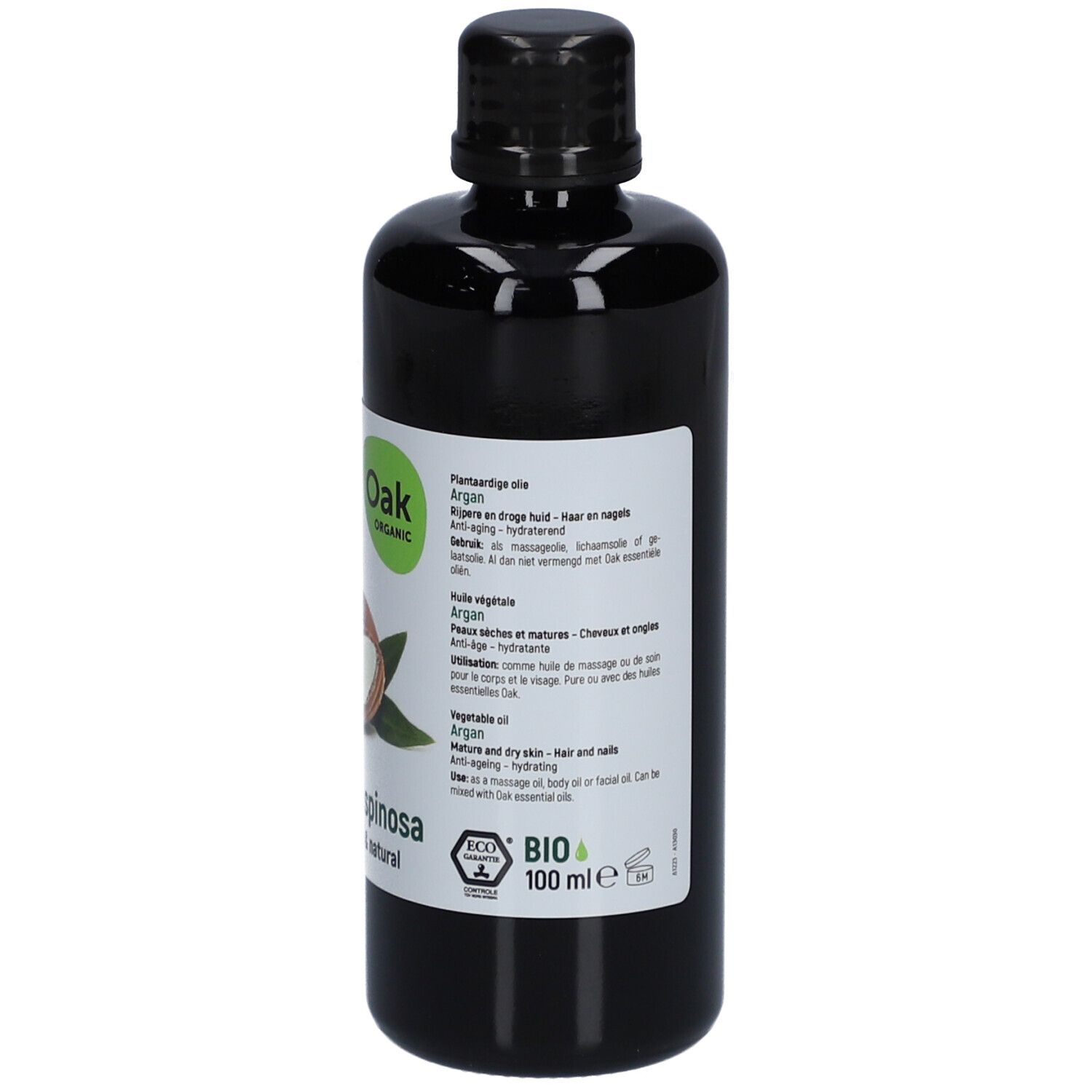 Schwarze Flasche mit Etikett. Auf dem Etikett: Oak Organic, Argan, 100 ml, Bio-Zertifizierung. Abbildung von Arganfrüchten.