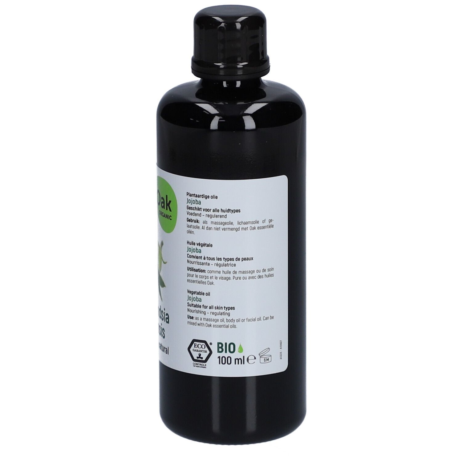 Schwarze Flasche mit weißem Etikett. Text in niederländischer Sprache. Oak Organic, Simmondsia chinensis, 100% pure & natural.
