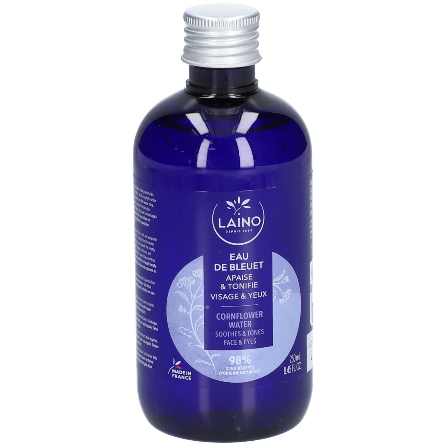 Blaue Flasche mit silbernem Deckel. Aufschrift: Laino Eau de Bleuet, beruhigt & tonisiert Gesicht & Augen. Enthält 98% Inhaltsstoffe natürlichen Ursprungs.