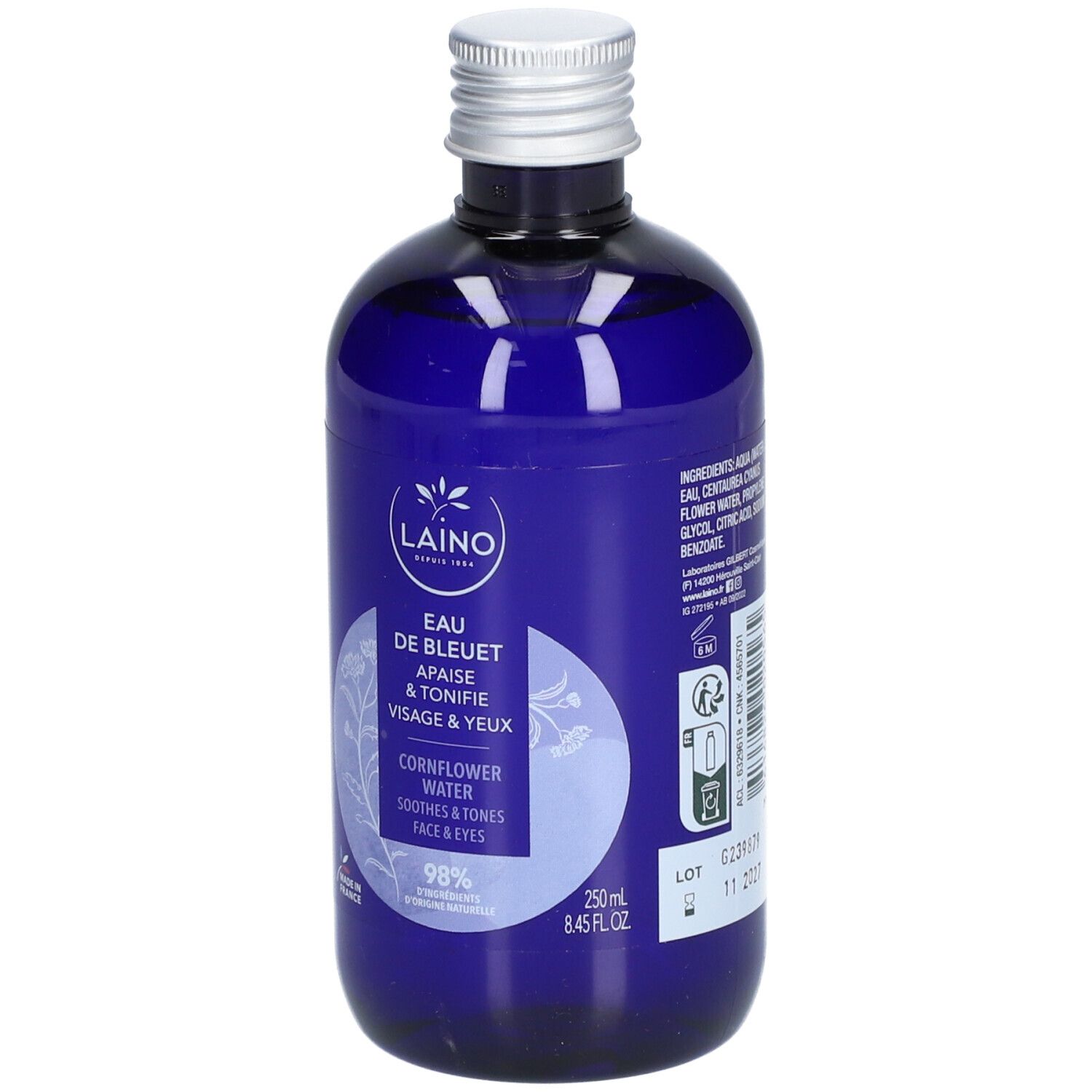 Blaue Flasche mit silbernem Deckel. Aufschrift: Laino Eau de Bleuet, beruhigt & tonisiert Gesicht & Augen. Enthält 98% Inhaltsstoffe natürlichen Ursprungs. Mit Chargennummer.
