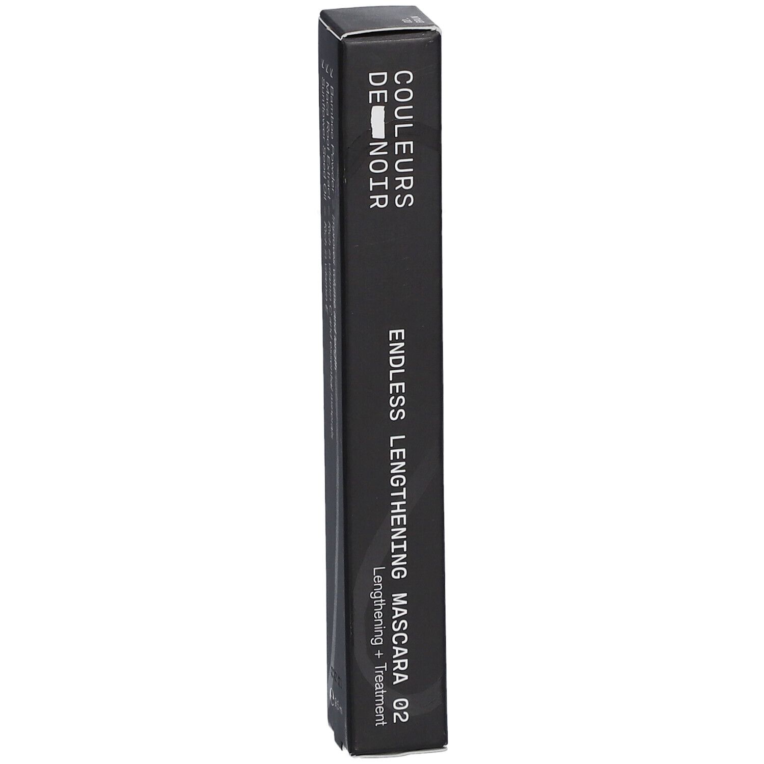 Emballage de mascara noir. Texte: COULEURS DE NOIR, ENDLESS LENGTHENING MASCARA 02. Emballage de mascara.