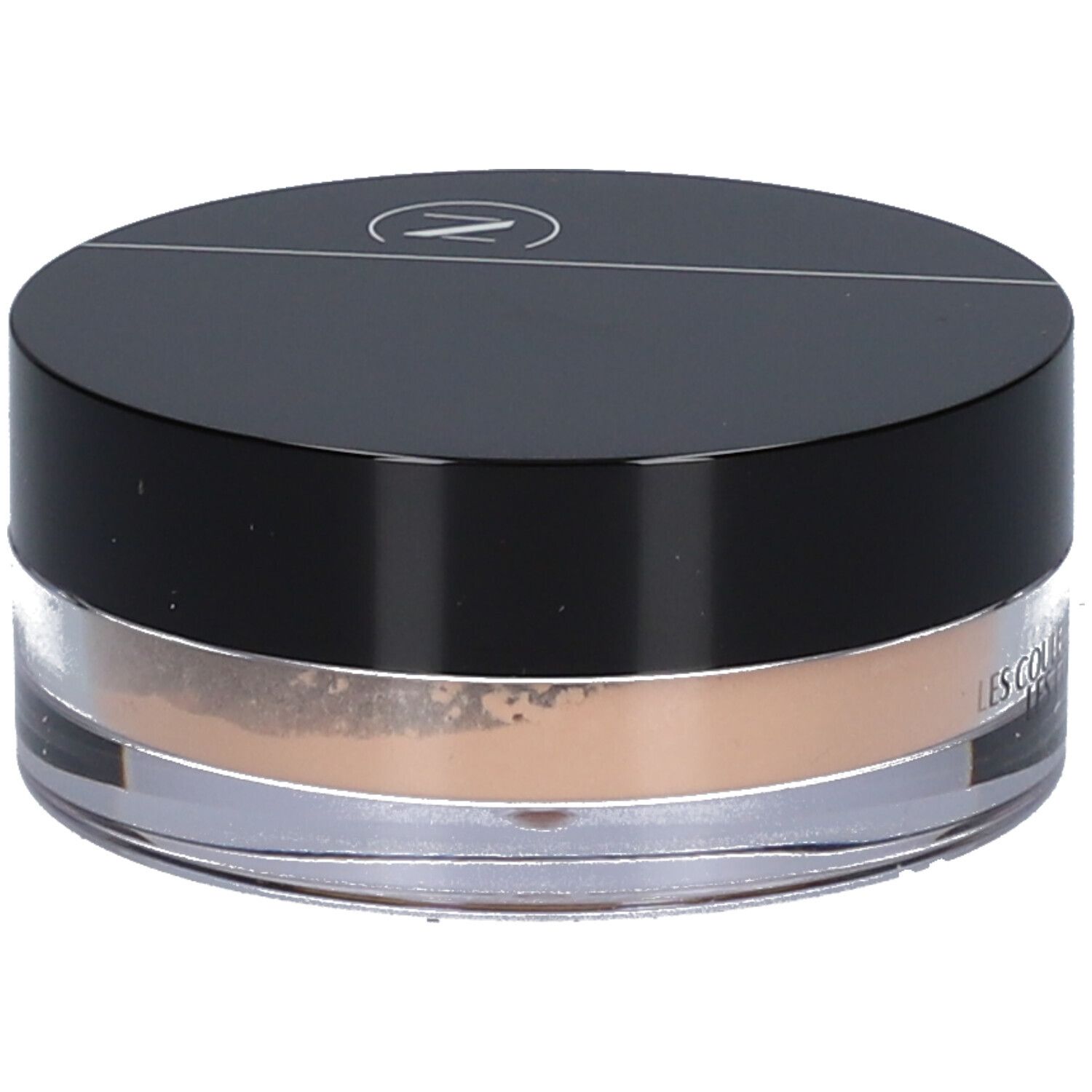 Pot rond de poudre teintée. Couvercle noir avec logo. Inscription: LES COULEURS DE NOIR.