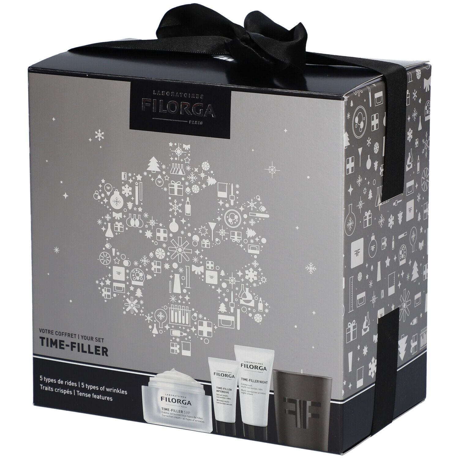 Coffret cadeau avec ruban noir. Boîte argentée avec logo Filorga et inscription Time-Filler. Contient crèmes et bougie.
