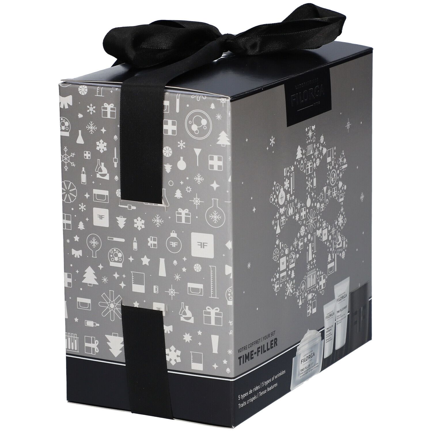 Coffret cadeau argenté avec ruban noir. Contient produits, logo Filorga et Time-Filler. Décorations de Noël.