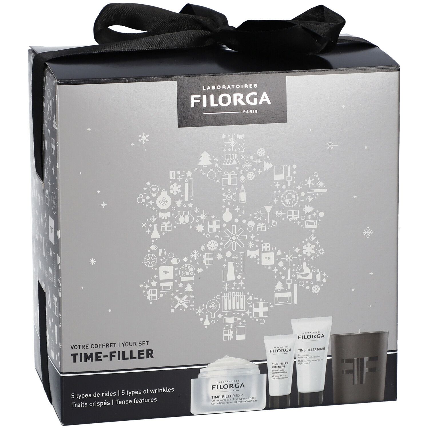 Coffret cadeau avec ruban noir. Boîte argentée avec logo Filorga et inscription Time-Filler. Contient crèmes et bougie.