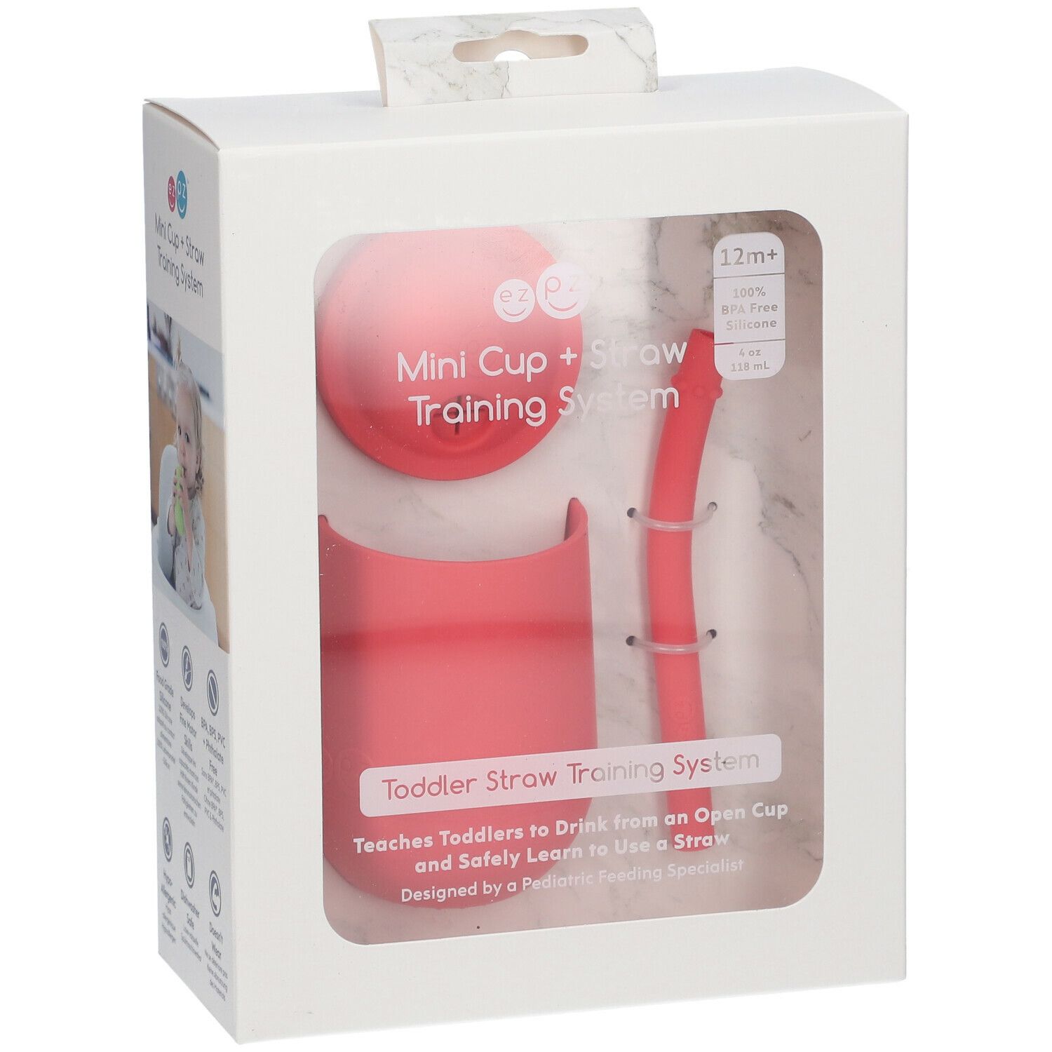 Emballage EzPz Mini Tasse + Paille Corail. Comprend tasse, couvercle et paille. Silicone corail. Fenêtre transparente.