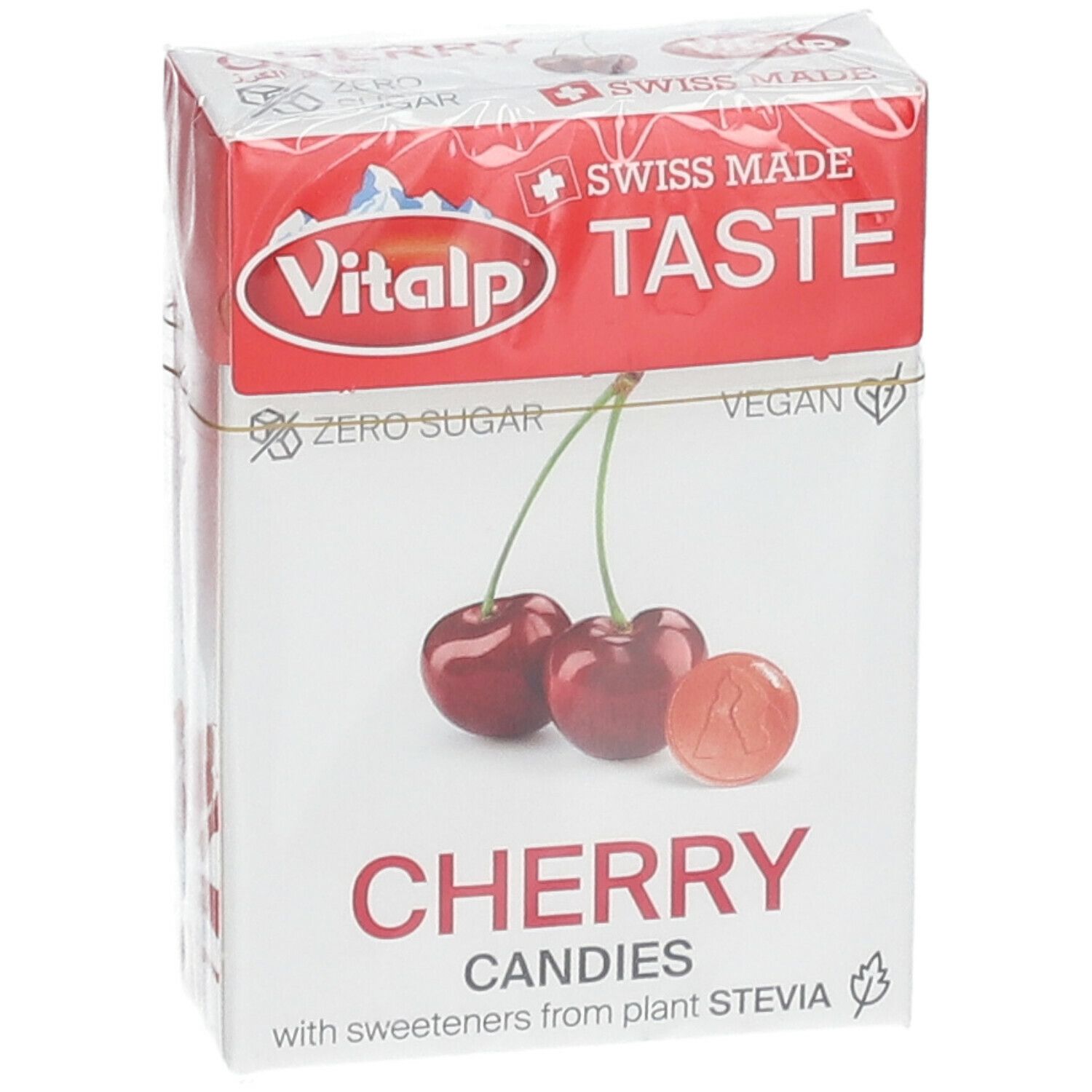 Verpakking met kersenbonbons. Opschrift: Vitalp, Cherry Candies, Swiss Made. Afbeelding van kersen.