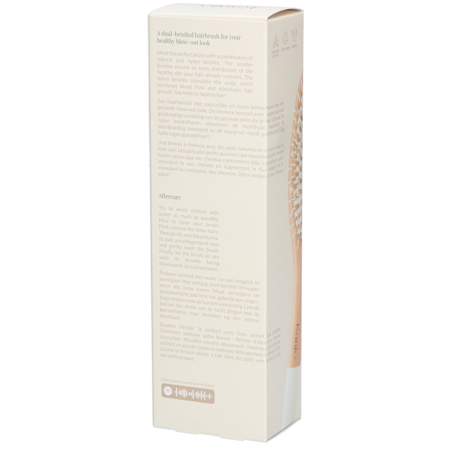 Verpackung der Kanjo Haarbürste. Text auf Englisch und Niederländisch. Holzgriff, helle Borsten.