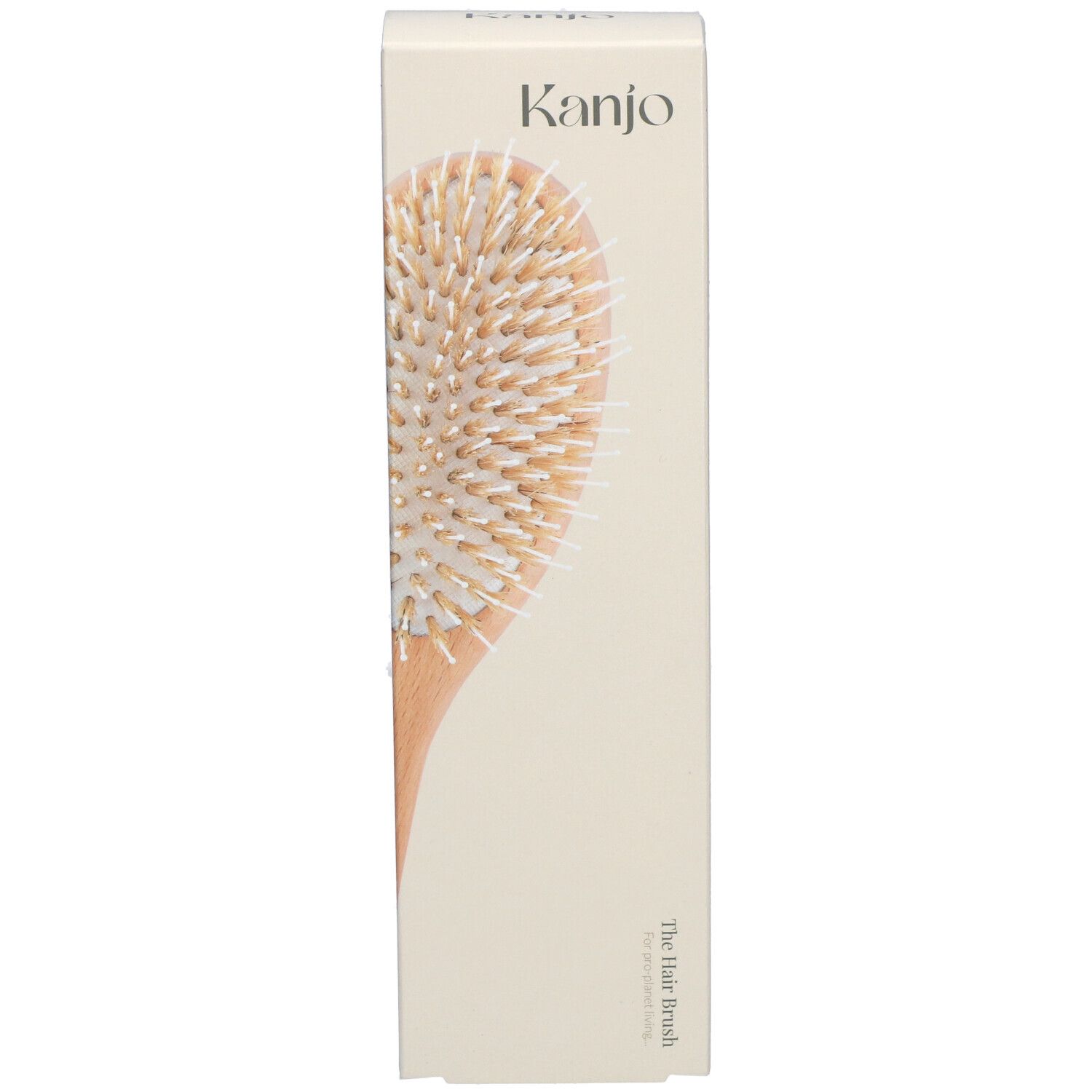Kanjo Haarbürste in Verpackung. Holzgriff, helle Borsten. Aufschrift: Kanjo, The Hair Brush.