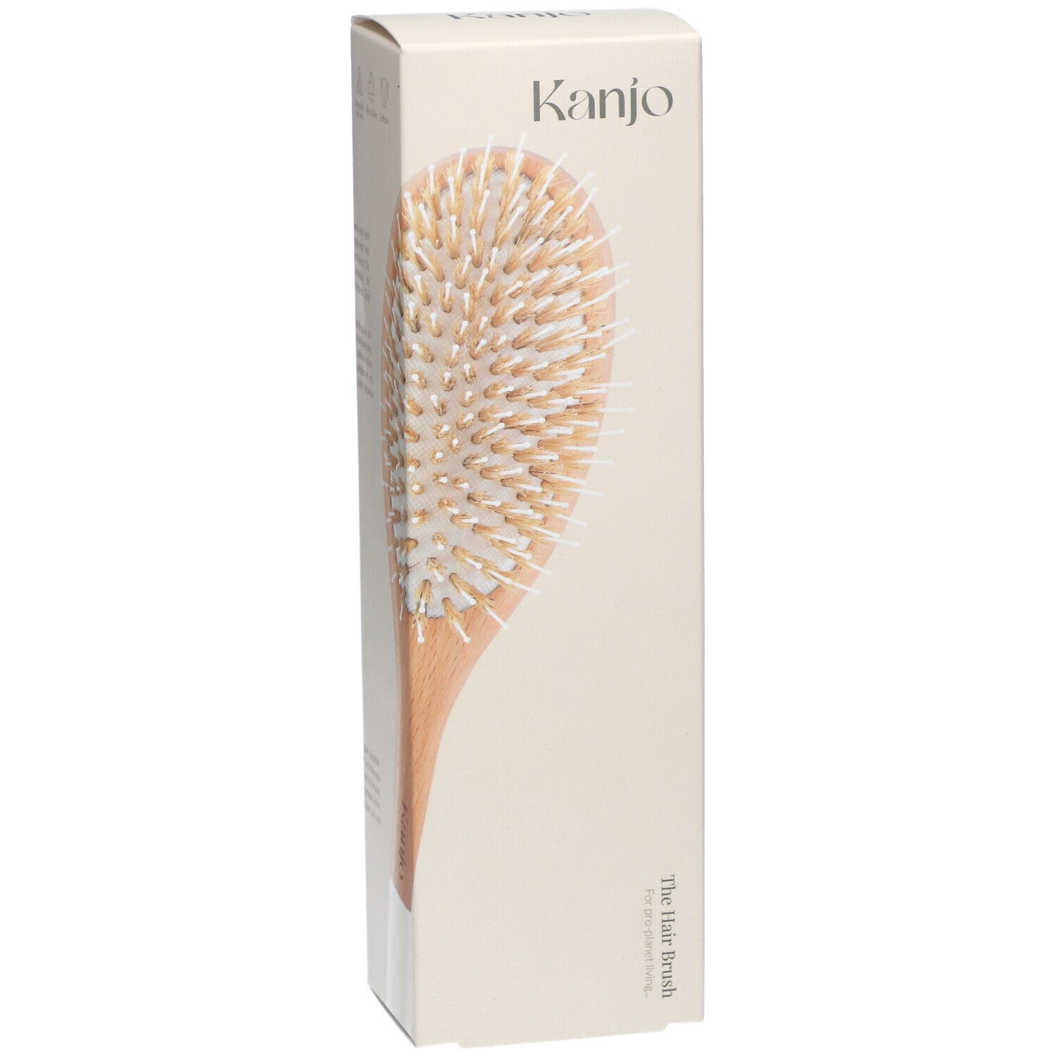 Kanjo Haarbürste in Verpackung. Holzgriff, helle Borsten. Aufschrift: Kanjo, The Hair Brush.