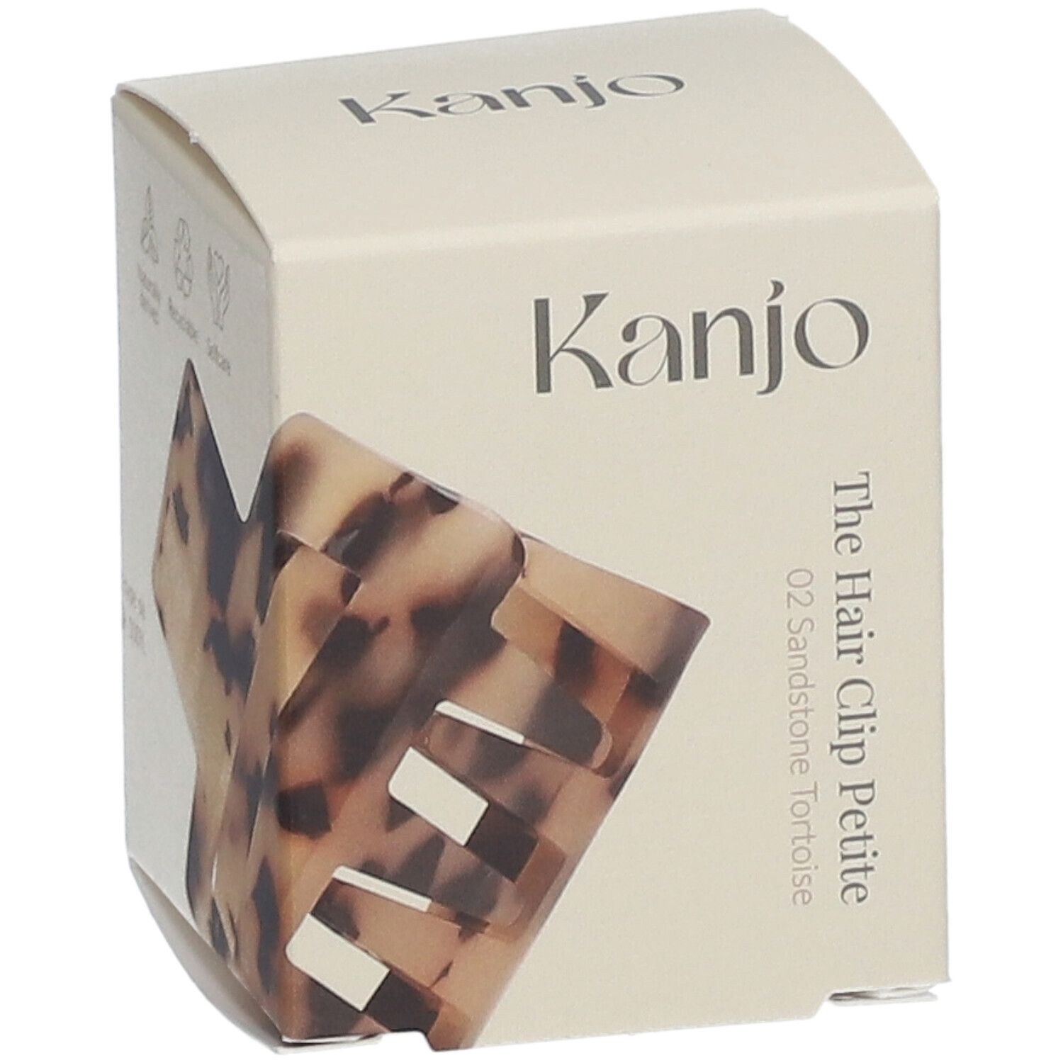 Emballage en carton avec logo Kanjo et nom du produit. La pince à cheveux Petite 02 Sandstone Tortoise est partiellement visible.