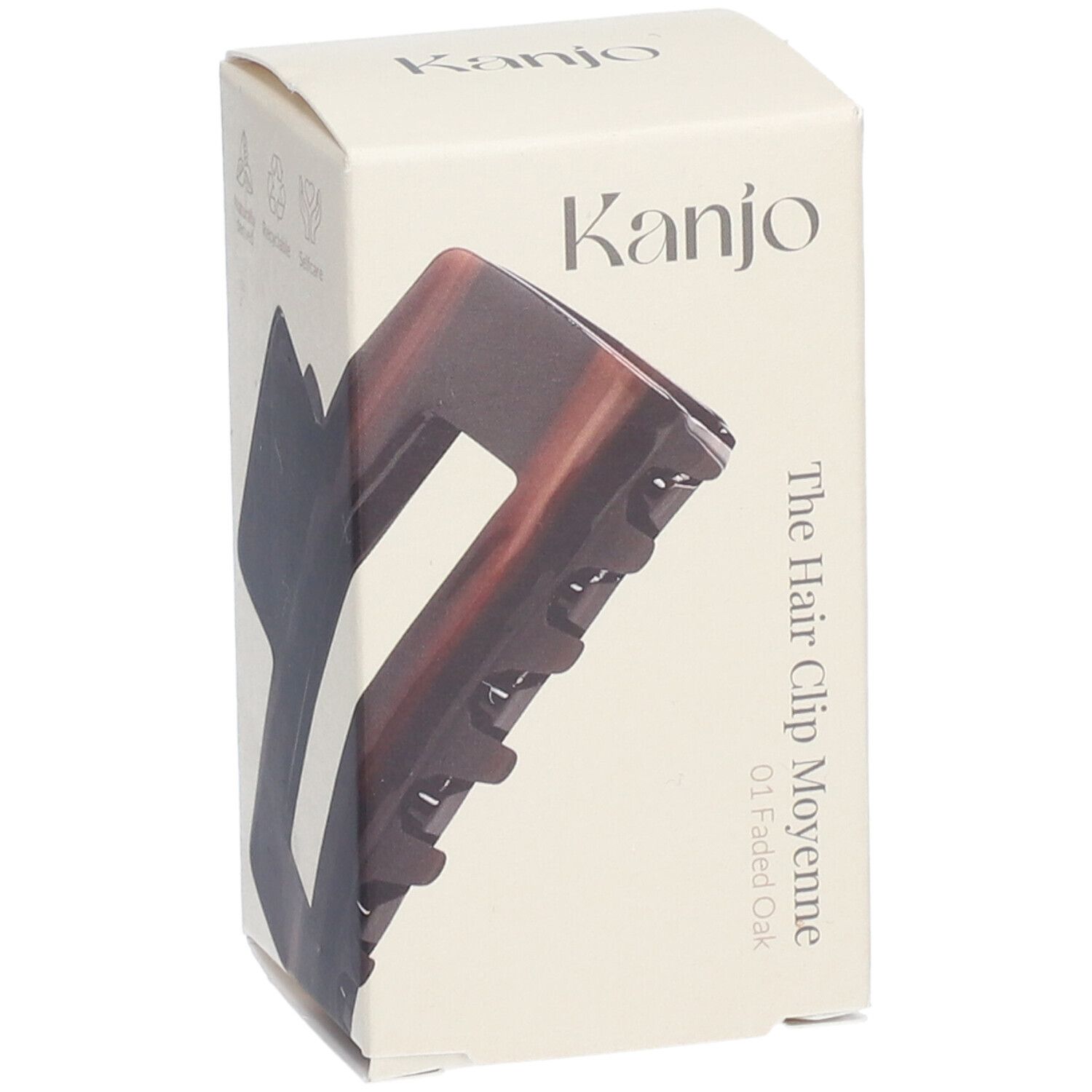 Haarspange in Verpackung. Marke: Kanjo. Aufschrift: The Hair Clip Moyenne 01 Faded Oak. Braun-transparente Farbe.