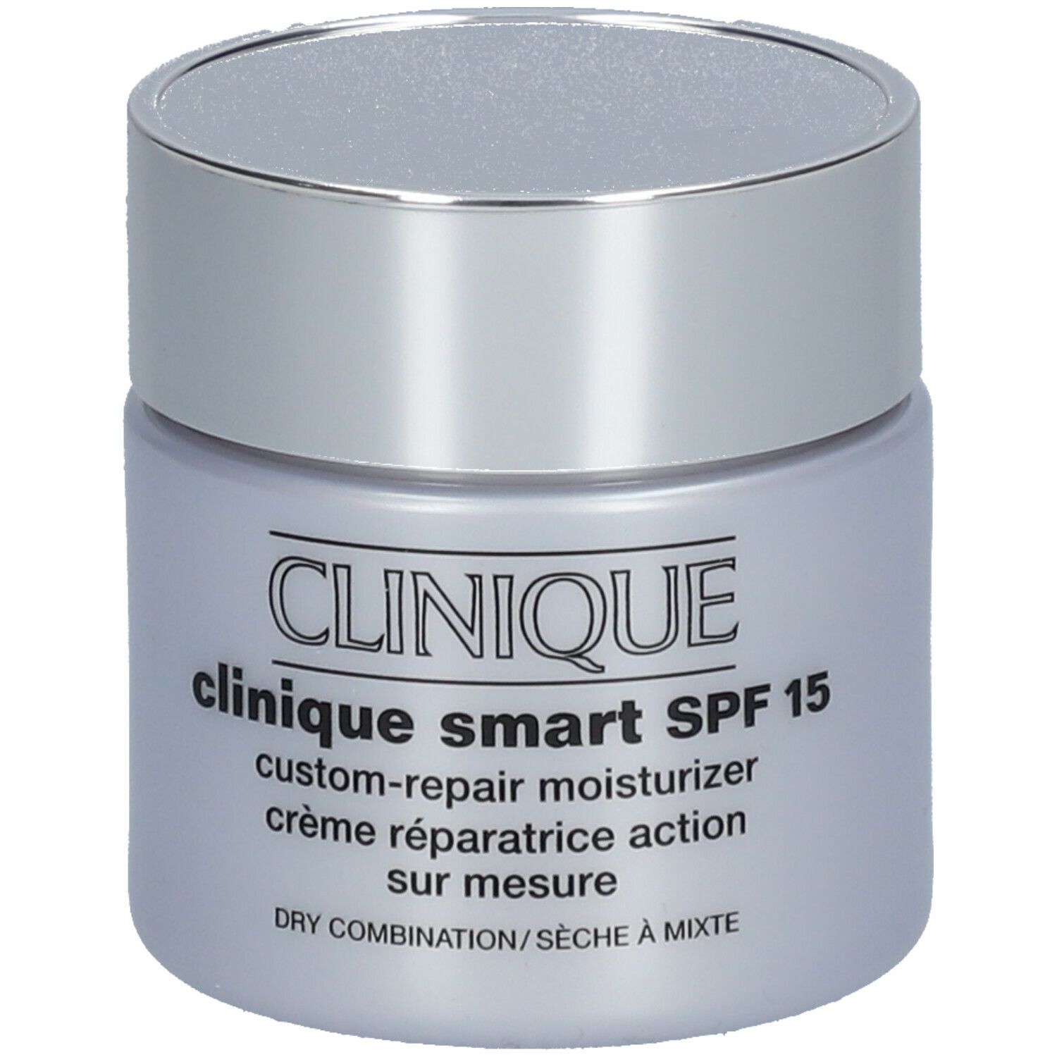 Pot de crème avec couvercle argenté. Inscription: CLINIQUE smart SPF 15 custom-repair moisturizer. Pour peaux sèches à mixtes.