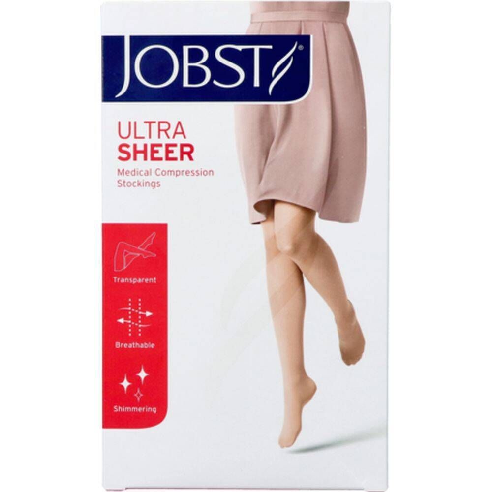 Verpackung mit JOBST Ultra Sheer Kompressionsstrümpfen. Bein einer Person, die Strümpfe trägt. Roter Bereich mit Eigenschaften.