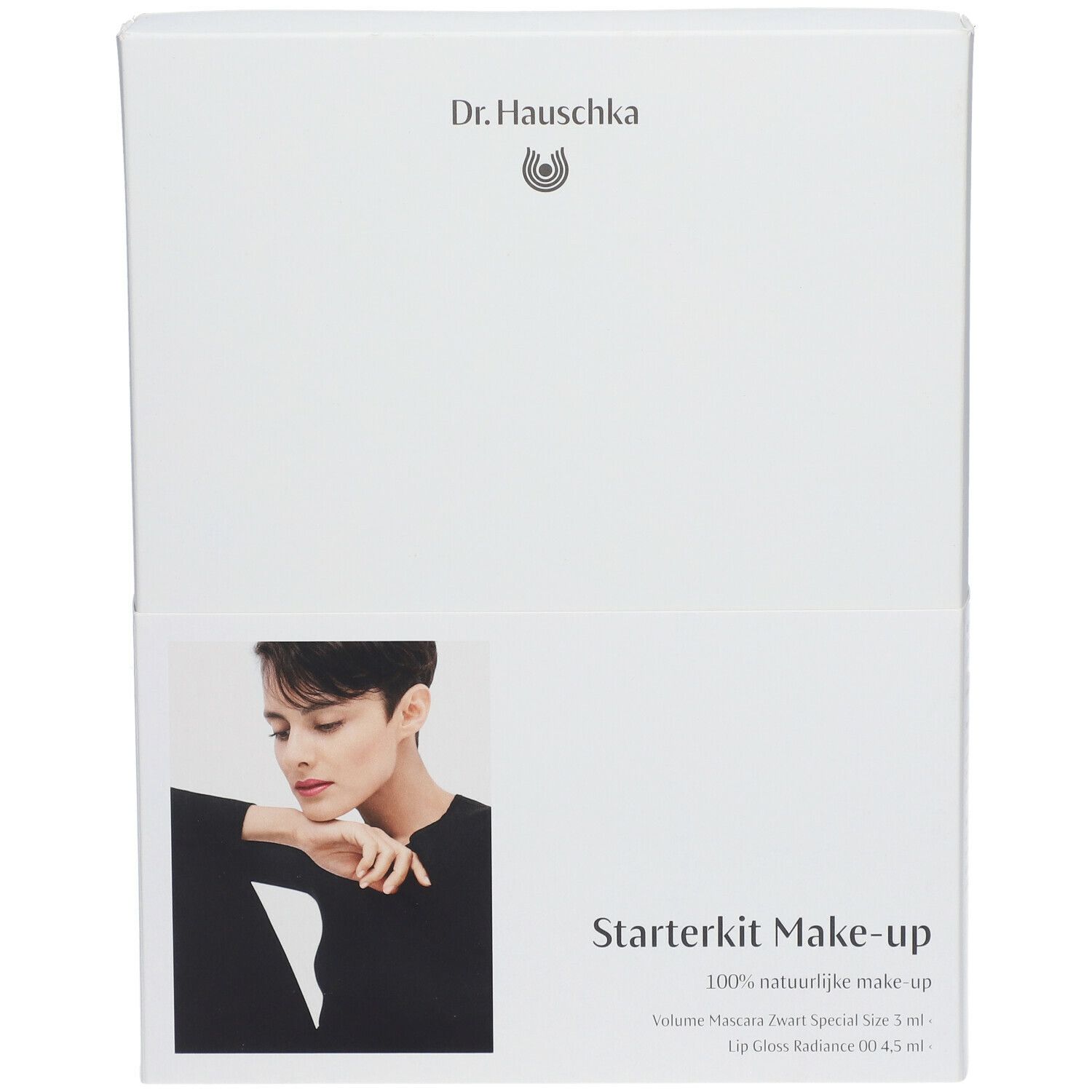 Boîte blanche avec image produit et texte Starterkit Make-up. Marque Dr. Hauschka. Contient mascara et brillant à lèvres.