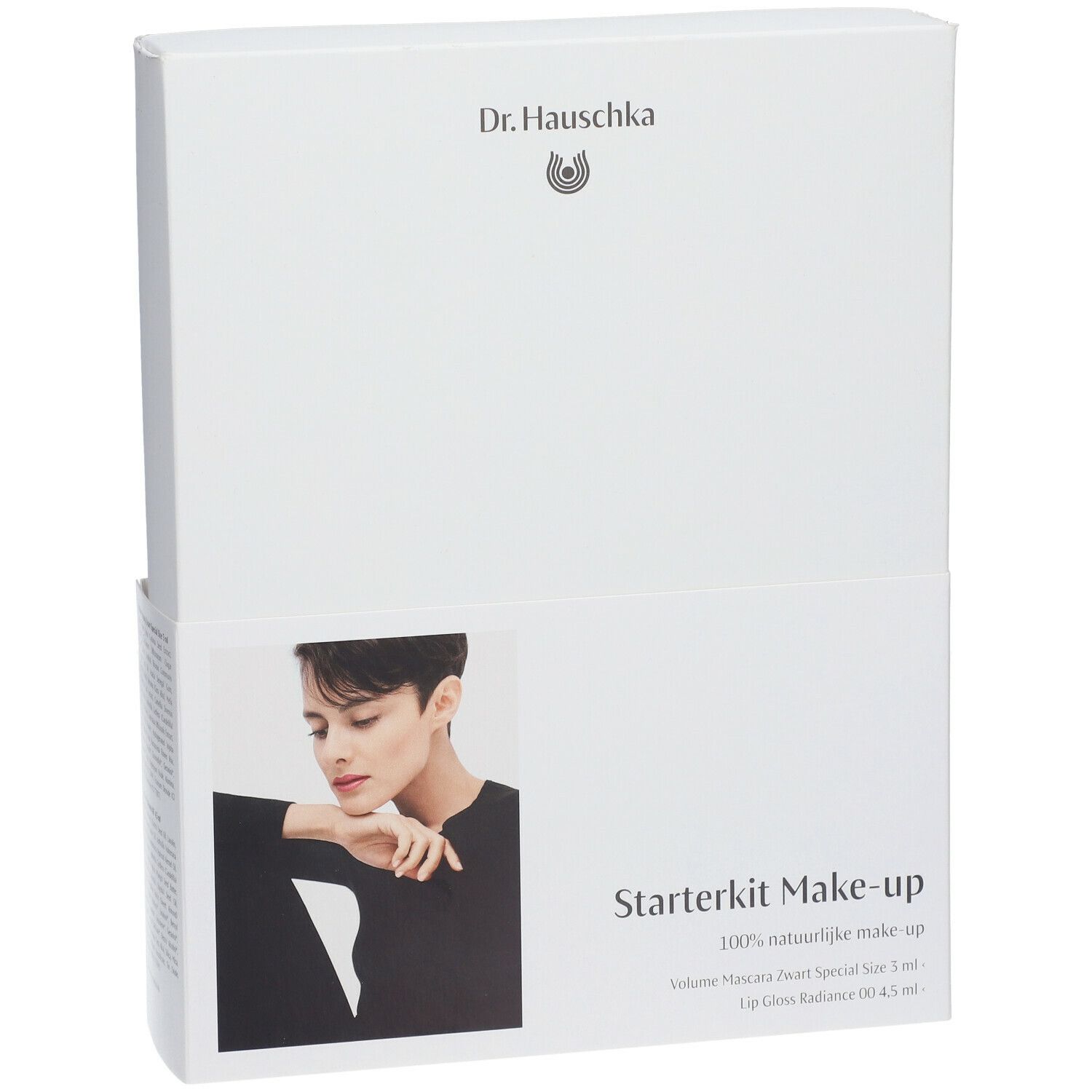 Boîte blanche avec image produit et texte Starterkit Make-up. Marque Dr. Hauschka. Contient mascara et brillant à lèvres.
