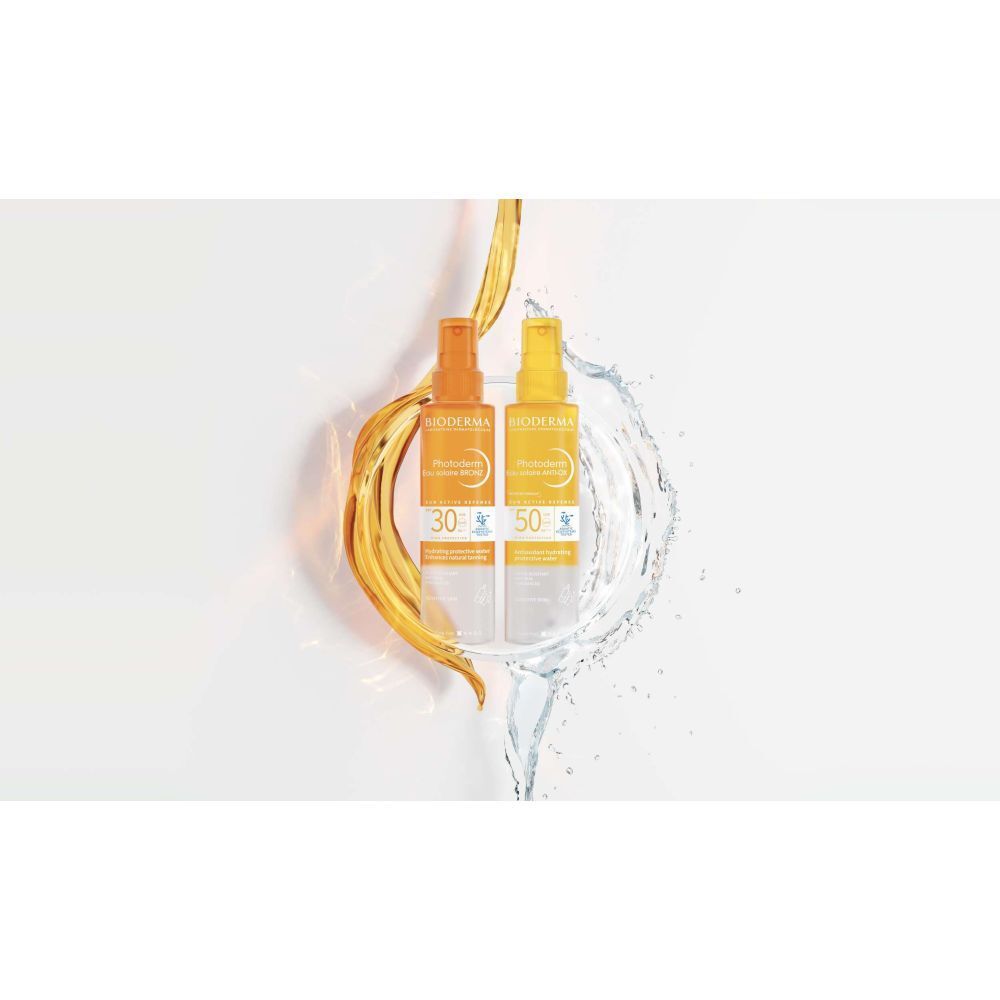 Deux flacons BIODERMA Photoderm Eau solaire Bronz, SPF 30 et 50, dans l'eau et l'huile. Concept de protection solaire.