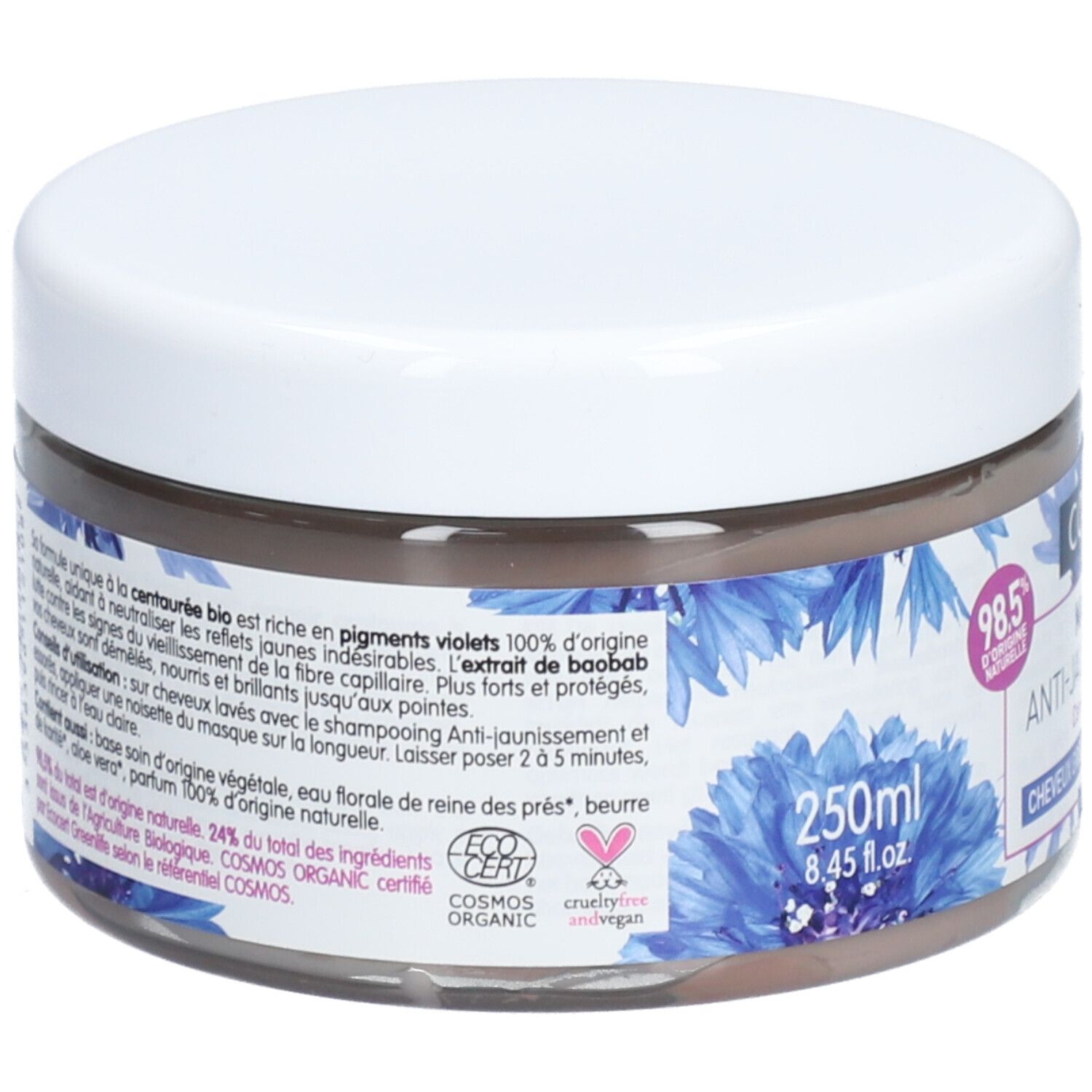 Pot rond avec couvercle blanc. Inscription: Coslys Masque Anti-Jaunissement. Motifs floraux bleus. 250ml. Texte en français.