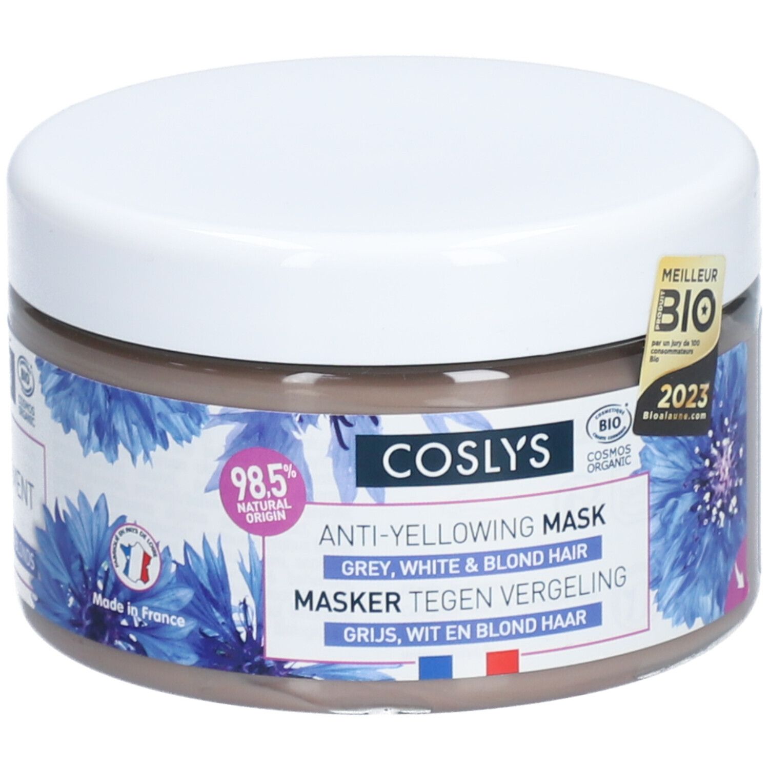 Pot rond avec couvercle blanc. Inscription: Coslys Anti-Yellowing Mask. Motifs floraux bleus. Label bio.
