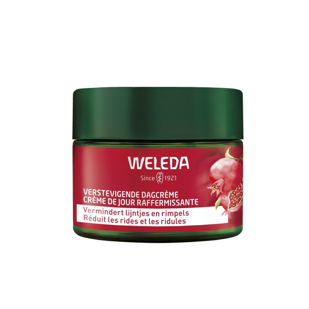 Pot rouge avec couvercle vert. Inscription: WELEDA, Crème de Jour Raffermissante. Illustration de grenade.