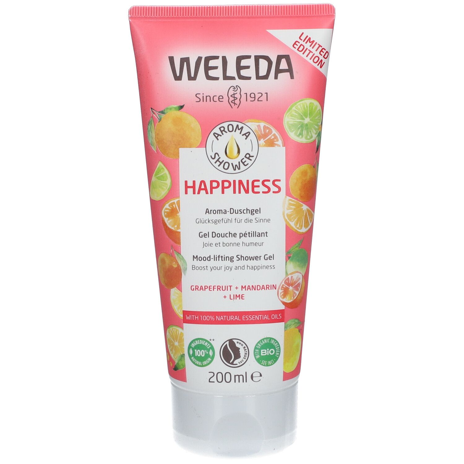 Roze tube met "WELEDA" en "Happiness". Illustraties van citrusvruchten. Tekst "Aroma Shower" en "Mood-lifting Shower Gel".