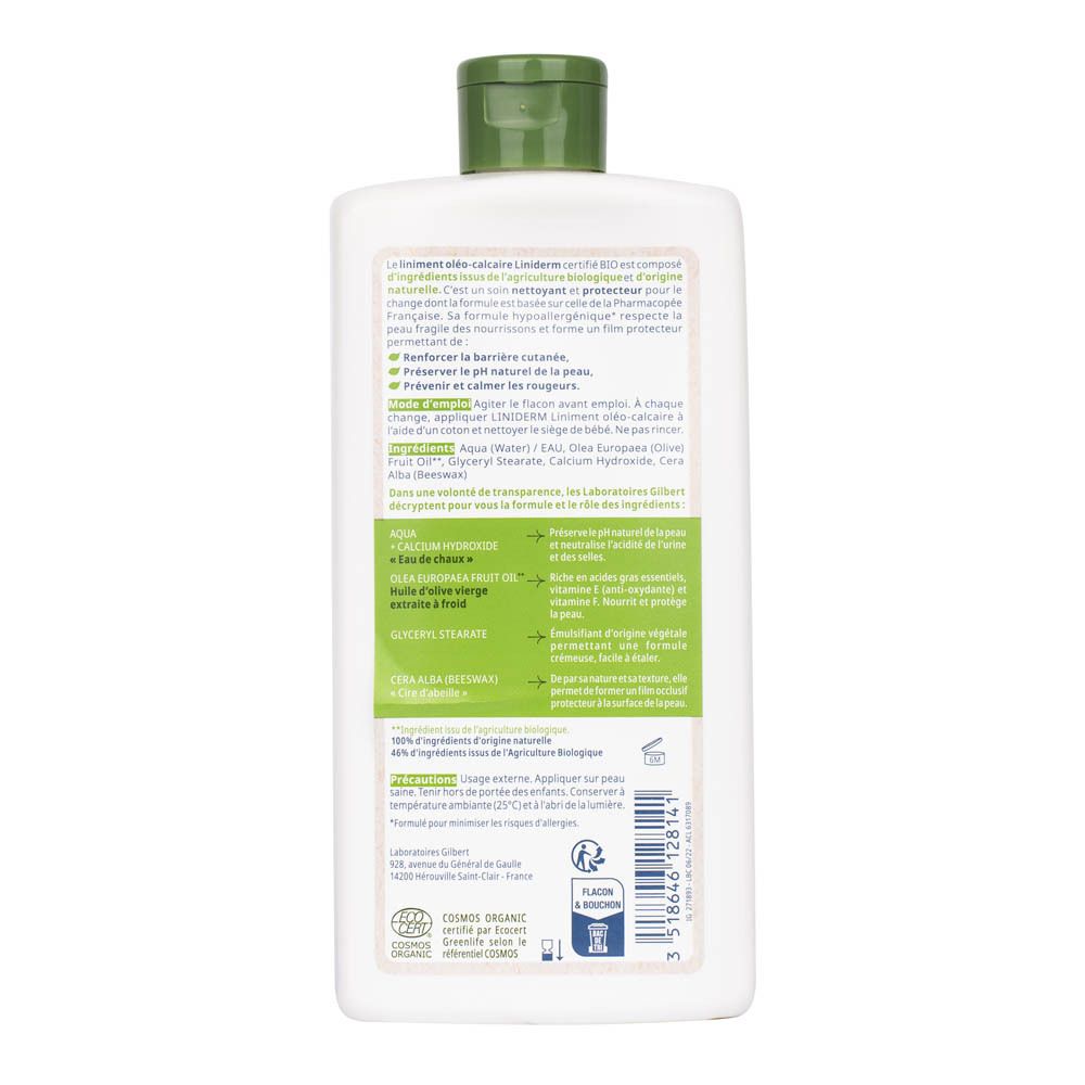 Dos d'un flacon blanc avec pompe verte. Texte multilingue. Informations produit.
