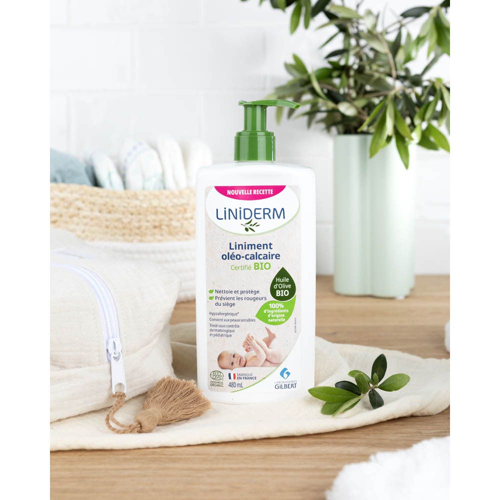Flacon blanc avec pompe verte. Inscription : Liniderm Oléo-Calcaire Bio. Produit en situation.