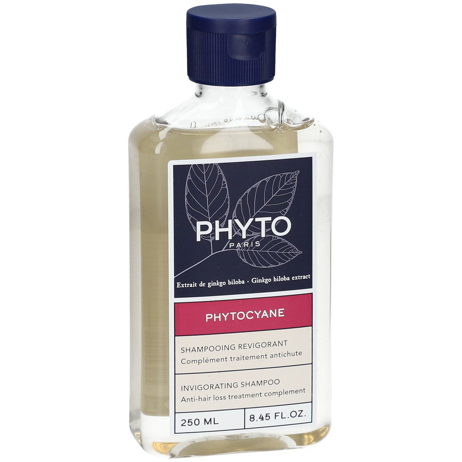 Flacon transparent, bouchon bleu. Étiquette "PHYTO PARIS", "PHYTOCYANE".