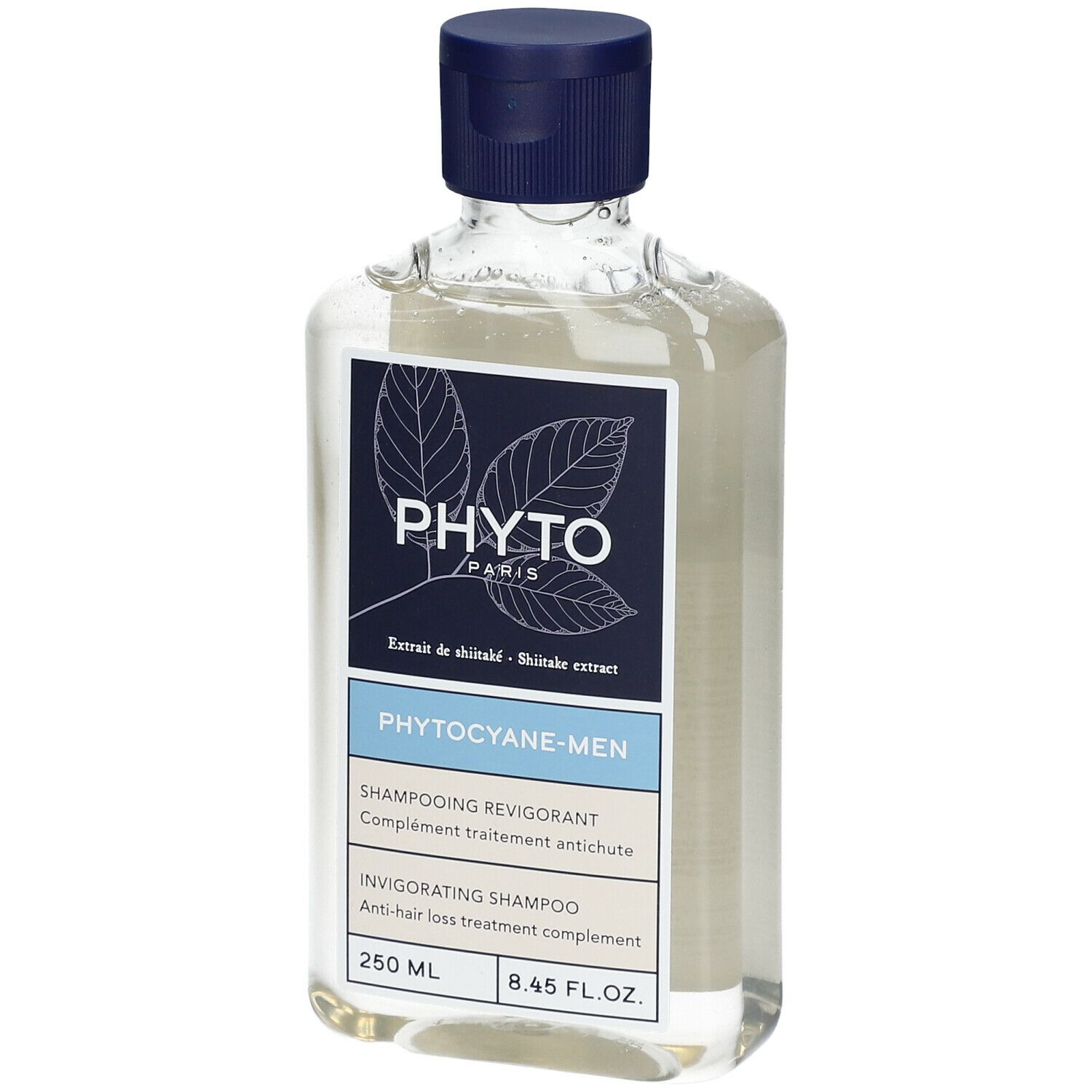 Flacon de shampooing transparent avec bouchon bleu. Étiquette avec nom de produit et marque.