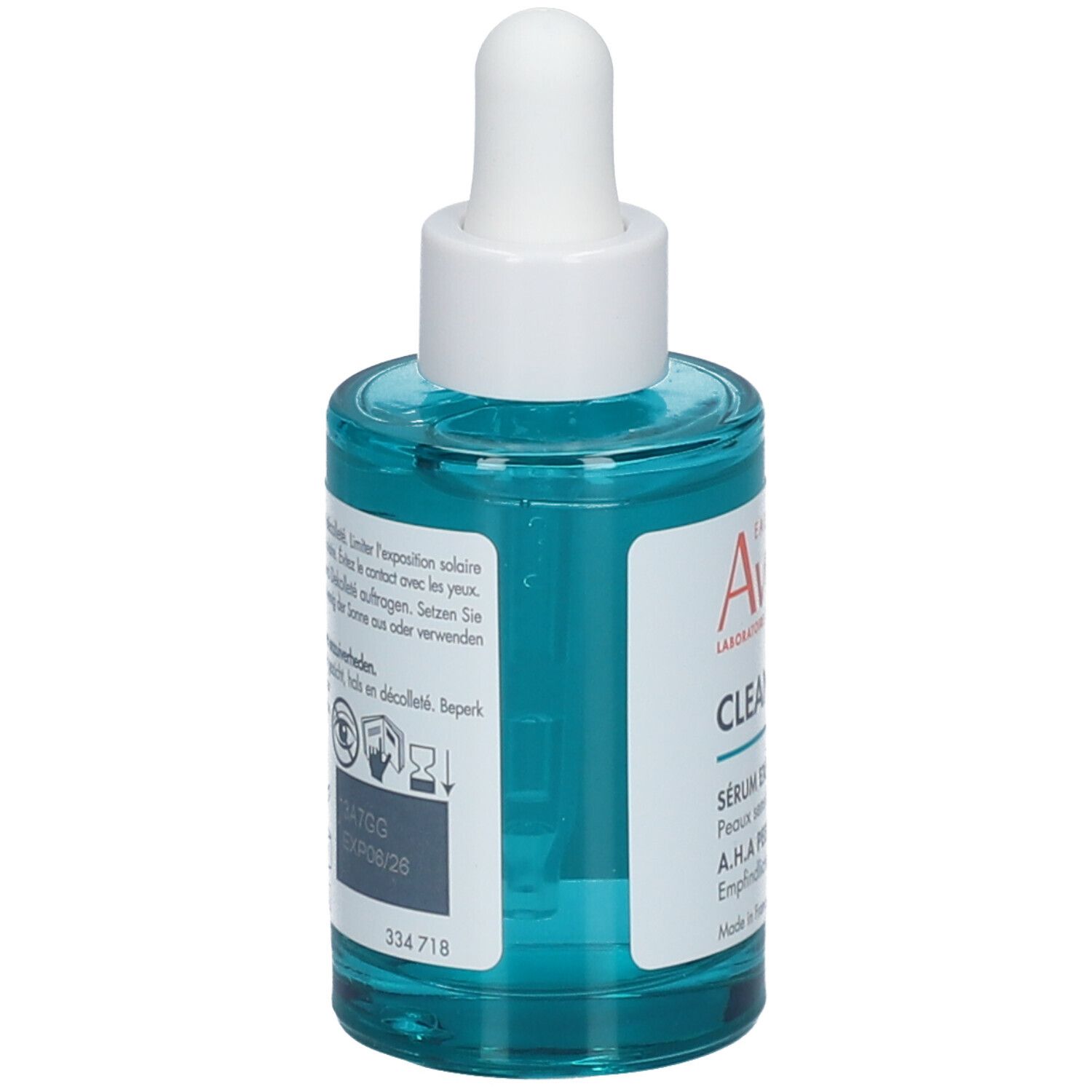 Achterkant van de blauwgroene fles met witte dop en pipet. Tekst en symbolen.