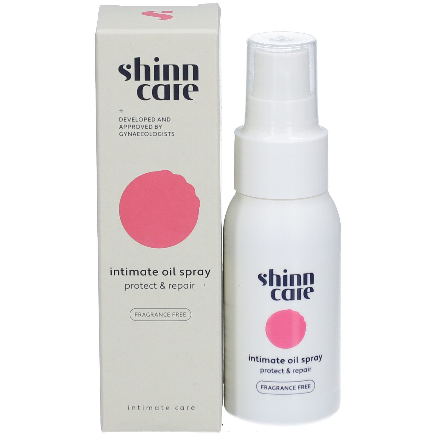 Produkt und Verpackung. Weiße Flasche und Schachtel mit rosa Kreis. Beschriftung: Shinn Care, Intimate Oil Spray Protect & Repair.