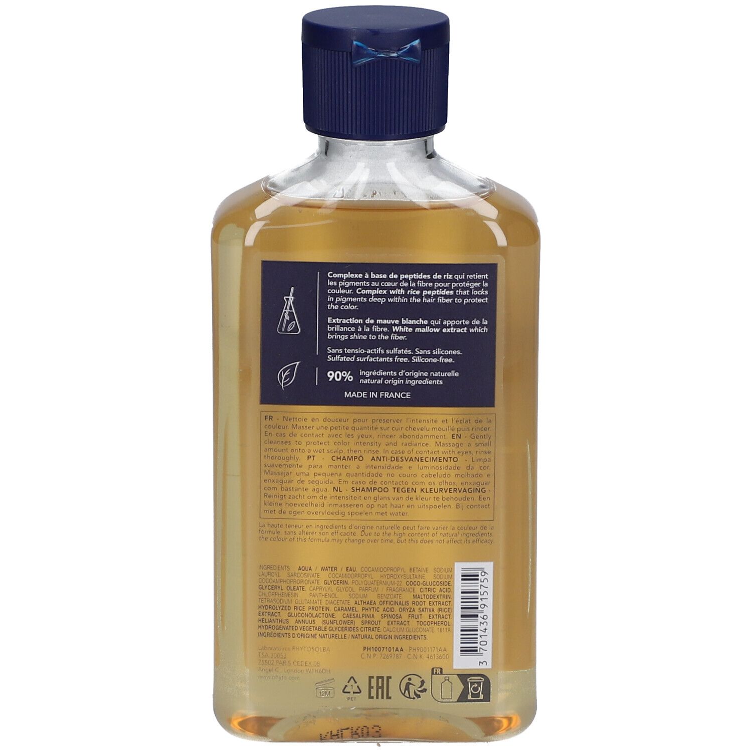 Achterkant van de shampoo fles. Bevat tekst en informatie over ingrediënten en herkomst.