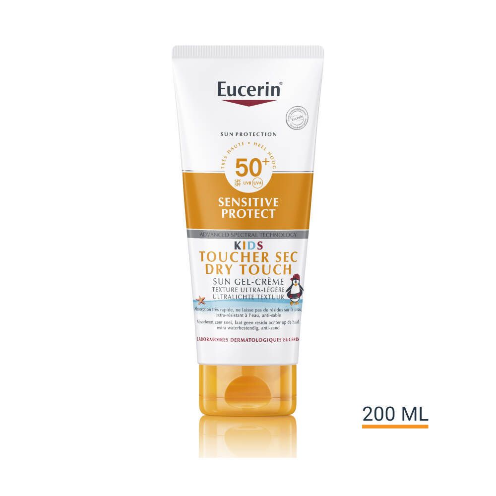 Tube de crème solaire, blanc-orange. Texte : SPF 50+, Sensitive Protect, Kids, Dry Touch. 200 ml. Illustration de pingouin.