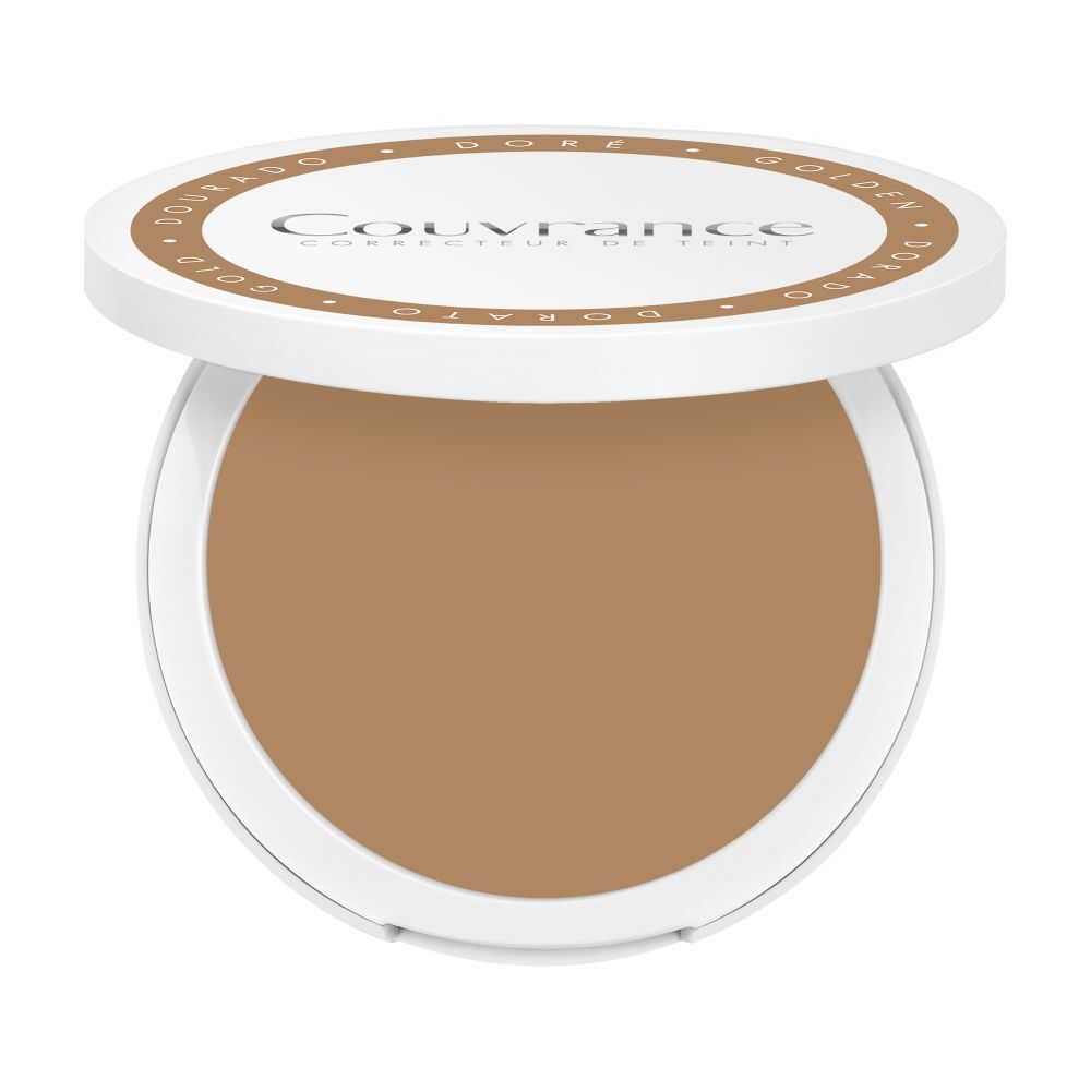 Fond de teint compact crème ouvert. Boîtier rond blanc avec maquillage brun. Couvercle avec nom et teinte.