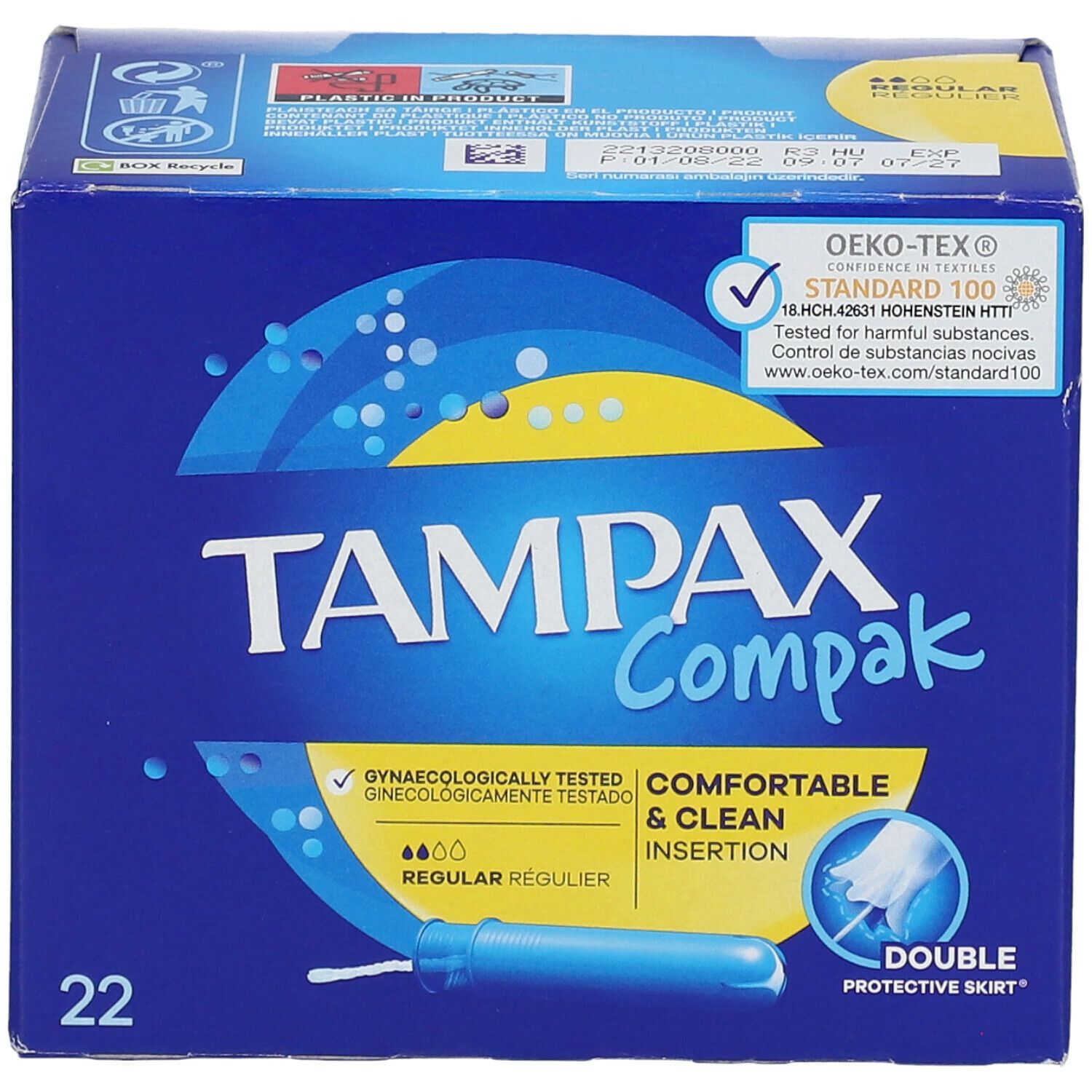 Face avant de la boîte 'Tampax Compak'. 22 unités. Label 'Oeko-Tex'. 'Testé gynécologiquement'. Bleu et jaune.